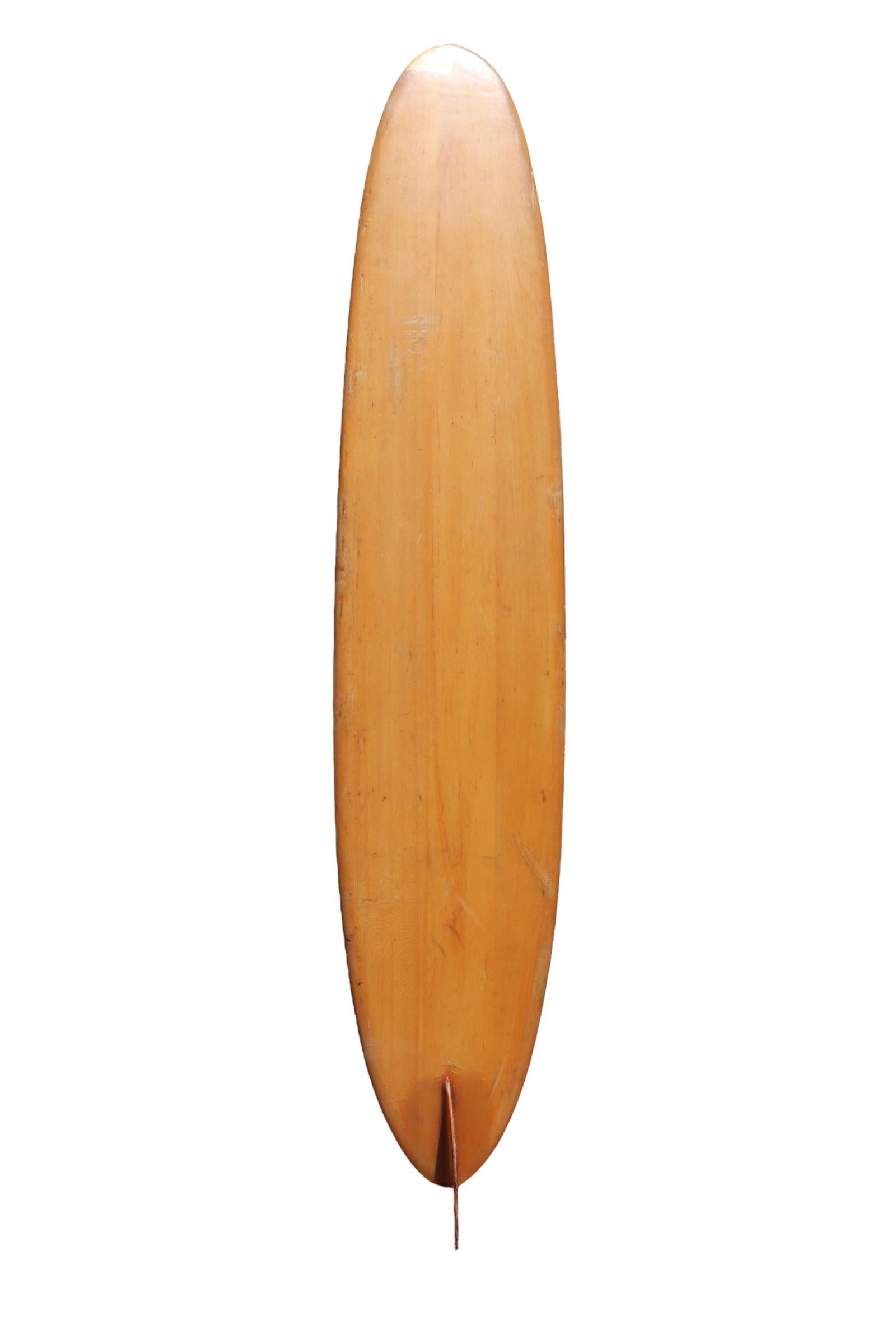 1958 Velzy Jacobs wooden balsa surfboard. Features the short lived “Surfboards by Velzy and Jacobs” laminate which was only used in the mid-late 1950s. The late Hap Jacobs (1930-2021) and the late Dale Velzy (1927-2005) joined forces in Venice