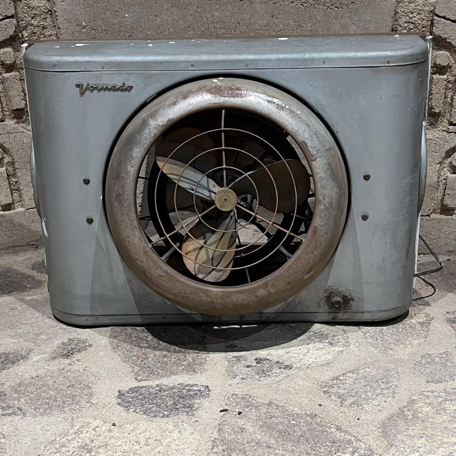 1950s Vintage Wall Unit Vornado Industrial Gray Electric Window Fan
18 h 37 w (open) 25.5 w closed x 9.5 d
Preowned unrestored vintage condition.
Missing circle with label in center
White paint drips. Dusty. Old Stock.
Tested and working! Ready to