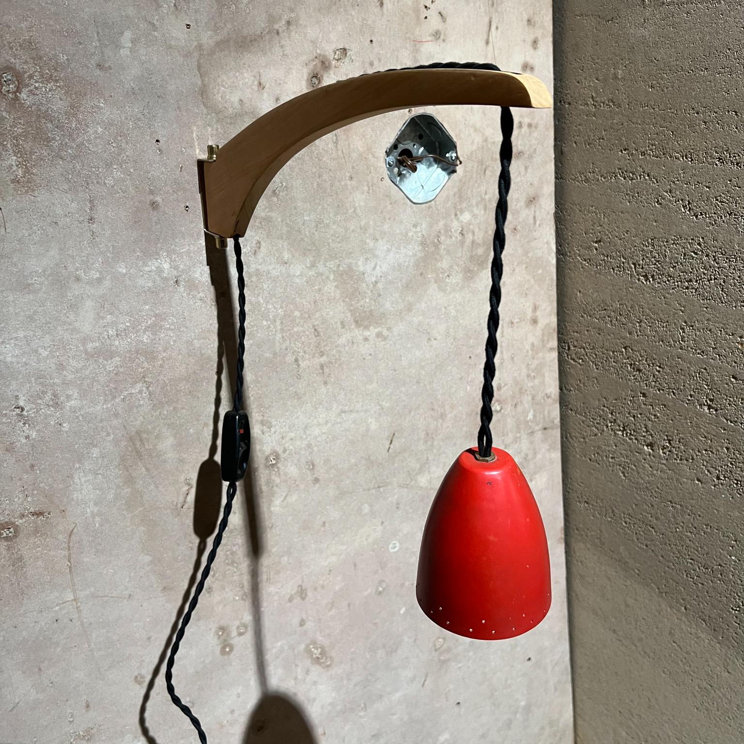 1950s Vintage wall lamp Perforated red shade sconce Style of Stilnovo Italy
Swivel arm mount and adjustable shade height with cord.
13 tall x 3.75 w x 18.25 d Shade 4.5 tall
Original unrestored vintage condition
Refer to images provided.