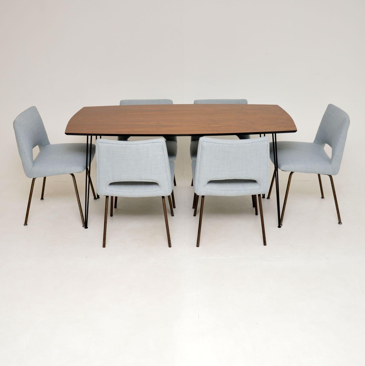 A gorgeous vintage dining suite, consisting of a walnut dining table with steel hairpin legs and six steel legged dining chairs. The table and chairs were both made in England, they both date from the 1950-1960’s.

We obtained these separately but
