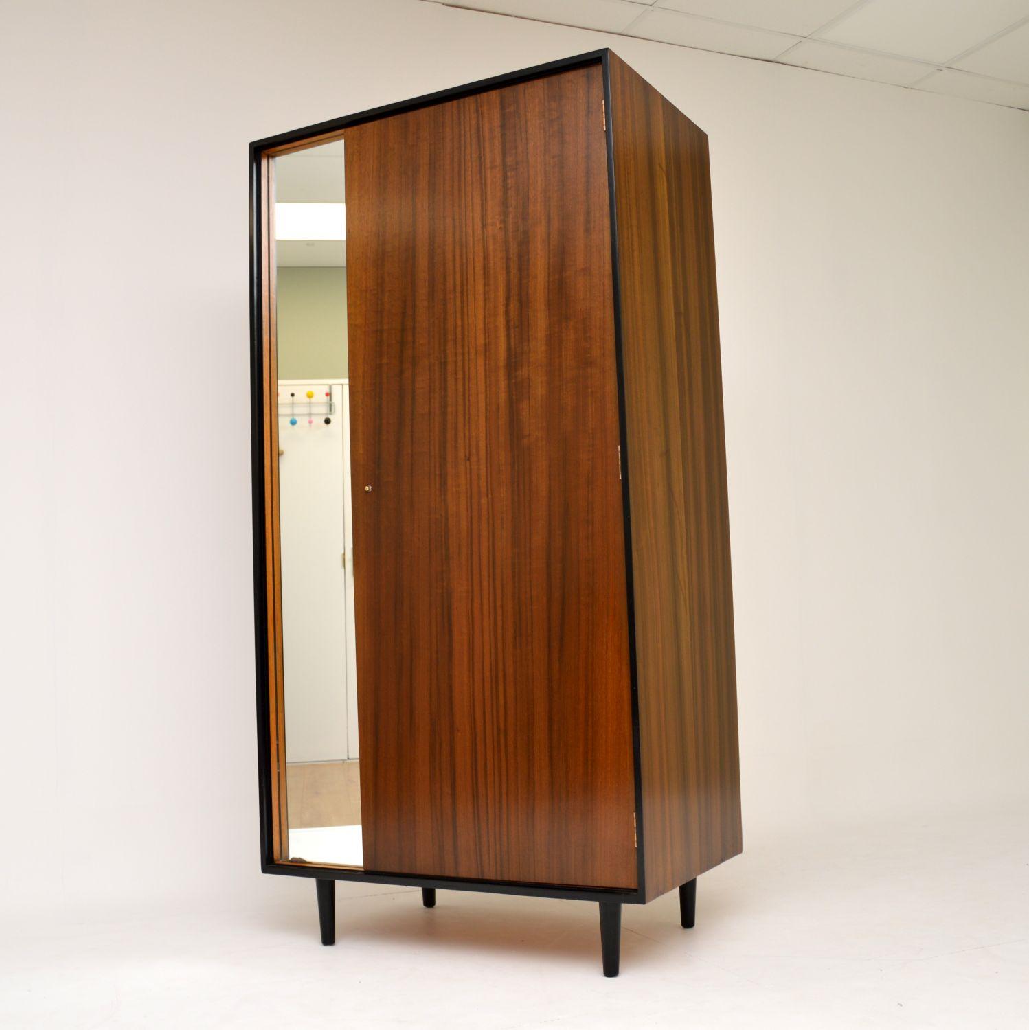 A beautifully designed and extremely well made vintage wardrobe in walnut, this dates from the 1950s. It was designed by John & Sylvia Reid for Stag’s C Range of furniture. We have had this stripped and re-polished to a very high standard, the