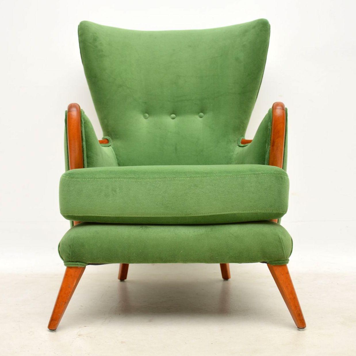 A beautiful and very striking and very comfortable vintage armchair, this was made by Howard Keith in the 1950s. We have had it fully restored, the frame has been stripped and re-polished to a very high standard, and we have had it fully