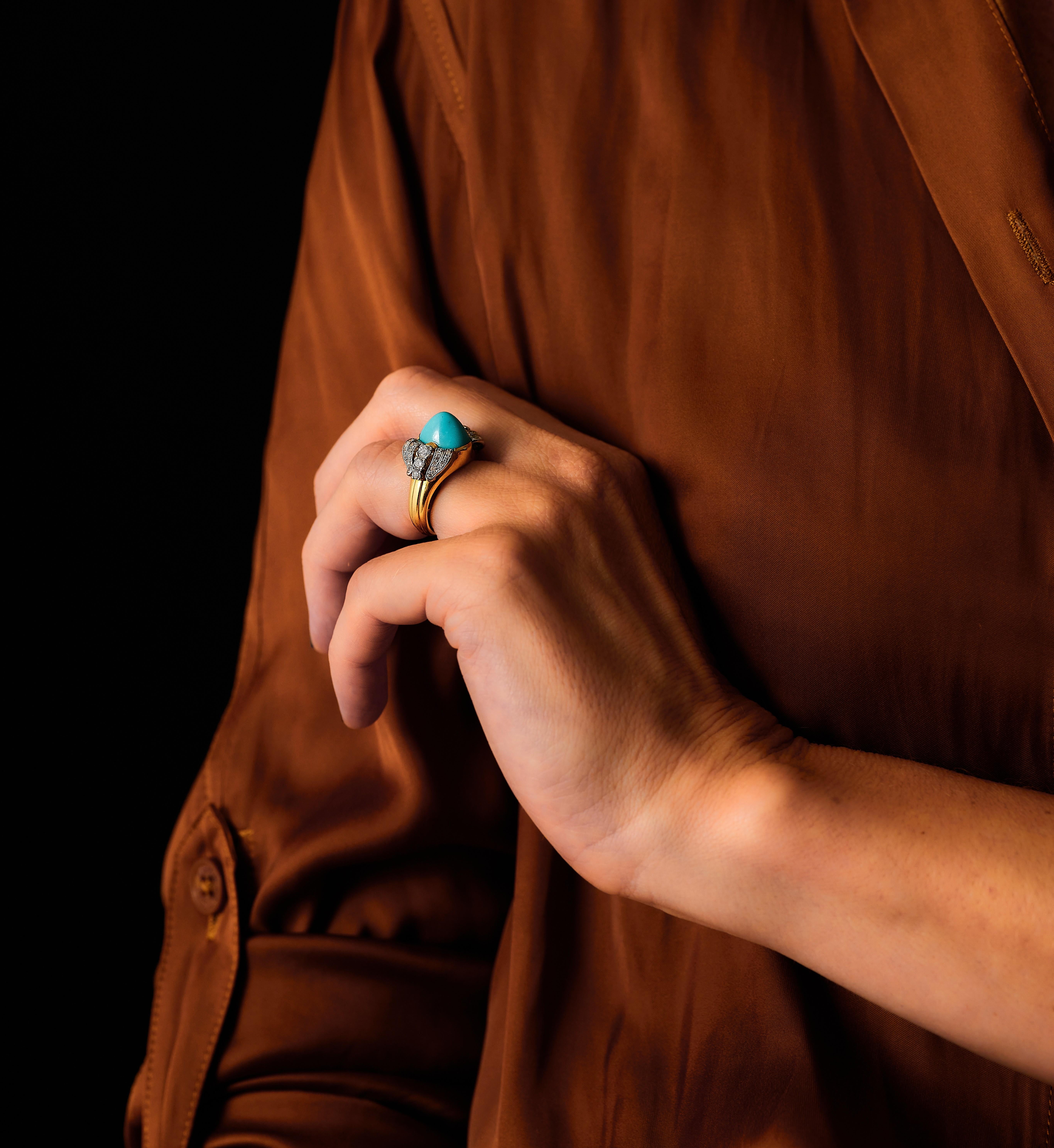 A striking mid-20th-century ring by the renowned Swedish court jeweler W.A. Bolin, featuring a vibrant turquoise set in 18K gold mount. 

Dating to the 1950s, the design reflects the understated elegance and clean lines characteristic of post-war