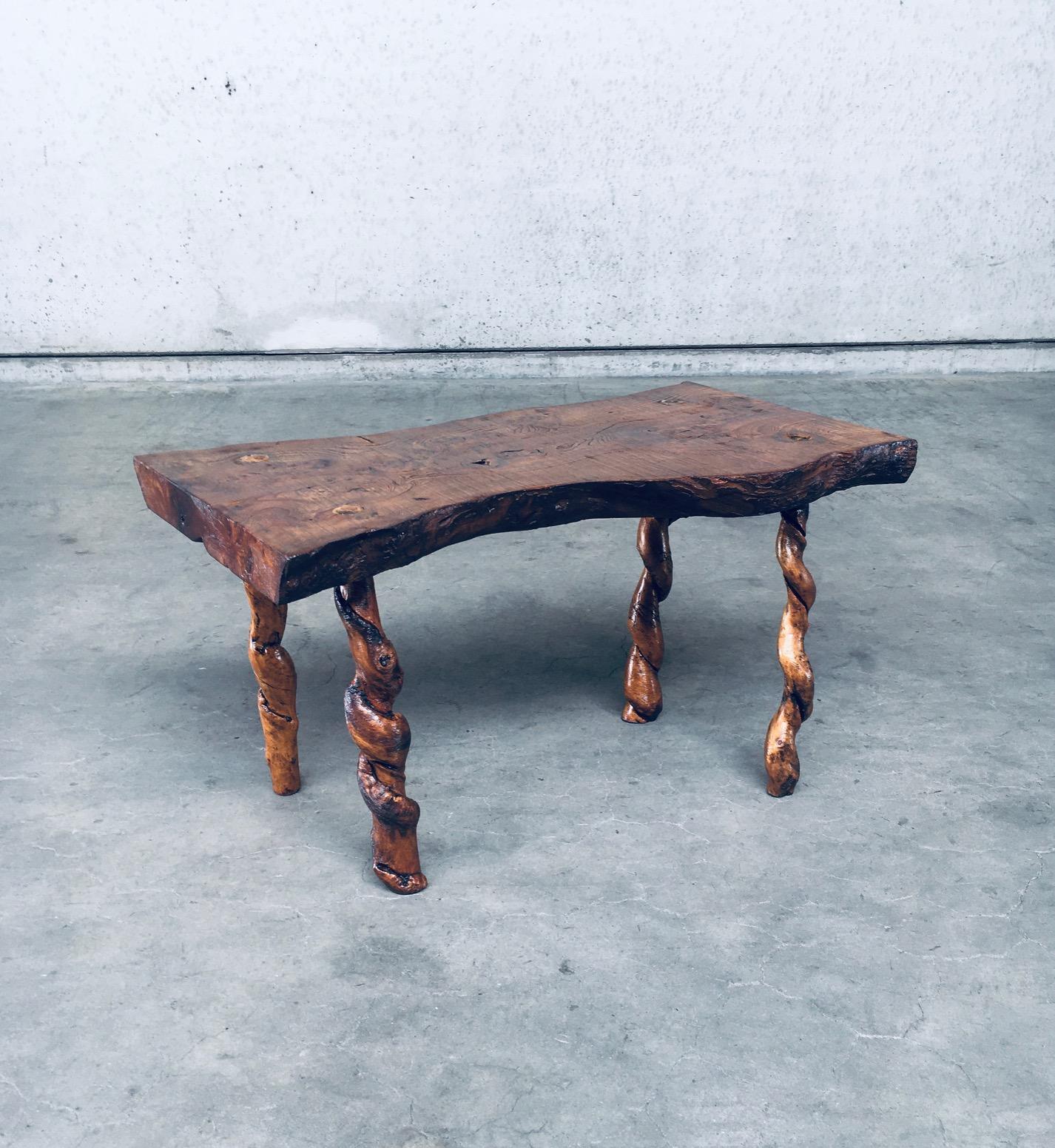 Vintage Brutalist Wabi Sabi style handcrafted side table. Hand made with a solid slab of oak wood with grape wood legs. Made in France in the 1940's / 50's. Crudely made. Has been restained and varnished. In very good solid condition. Measures 88cm