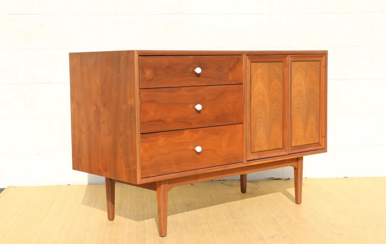 Spectacular modern credenza or bar cabinet designed by Kipp Stewart for Drexel Declaration Collection, it has the label inside the drawer, showing in the picture. The dresser is originally from the 1950’s. Made of solid walnut wood, with original