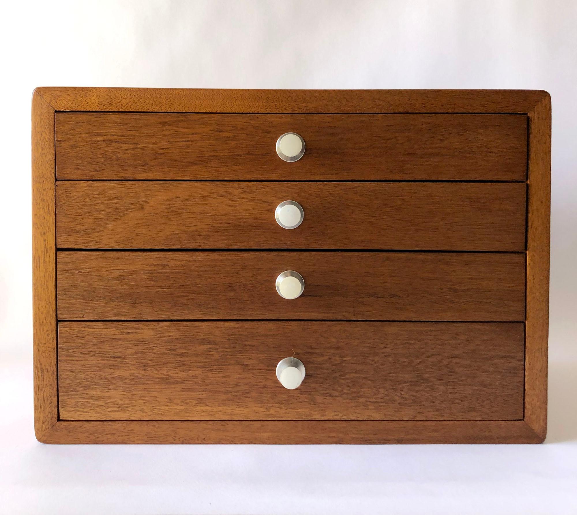 Mid-Century Modern walnut jewelry chest with stainless steel drawer pulls in the style of George Nelson. Piece measures 12.25