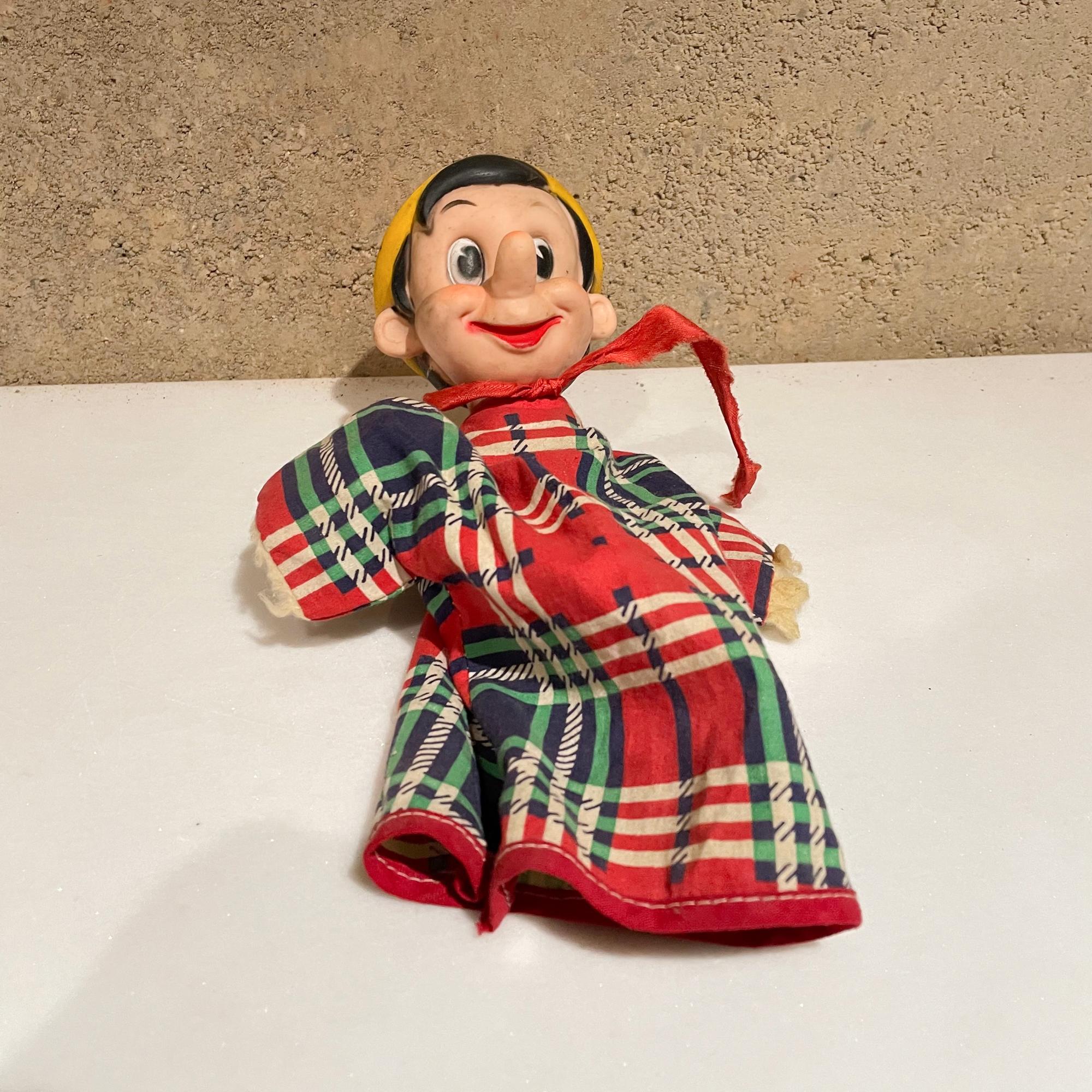 Pinocchio
Walt Disney's Pinocchio 1950s hand puppet vintage by Gund Mfg New York
Measures: 10 H x 7 W x 2.75 inches
Maker label present.
Original unrestored preowned vintage. See our images.
  
  