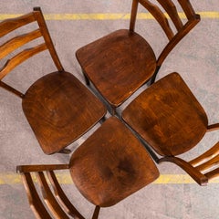 Chaise de salle à manger à dossier incliné en chêne chaud des années 1950 - Lot de quatre