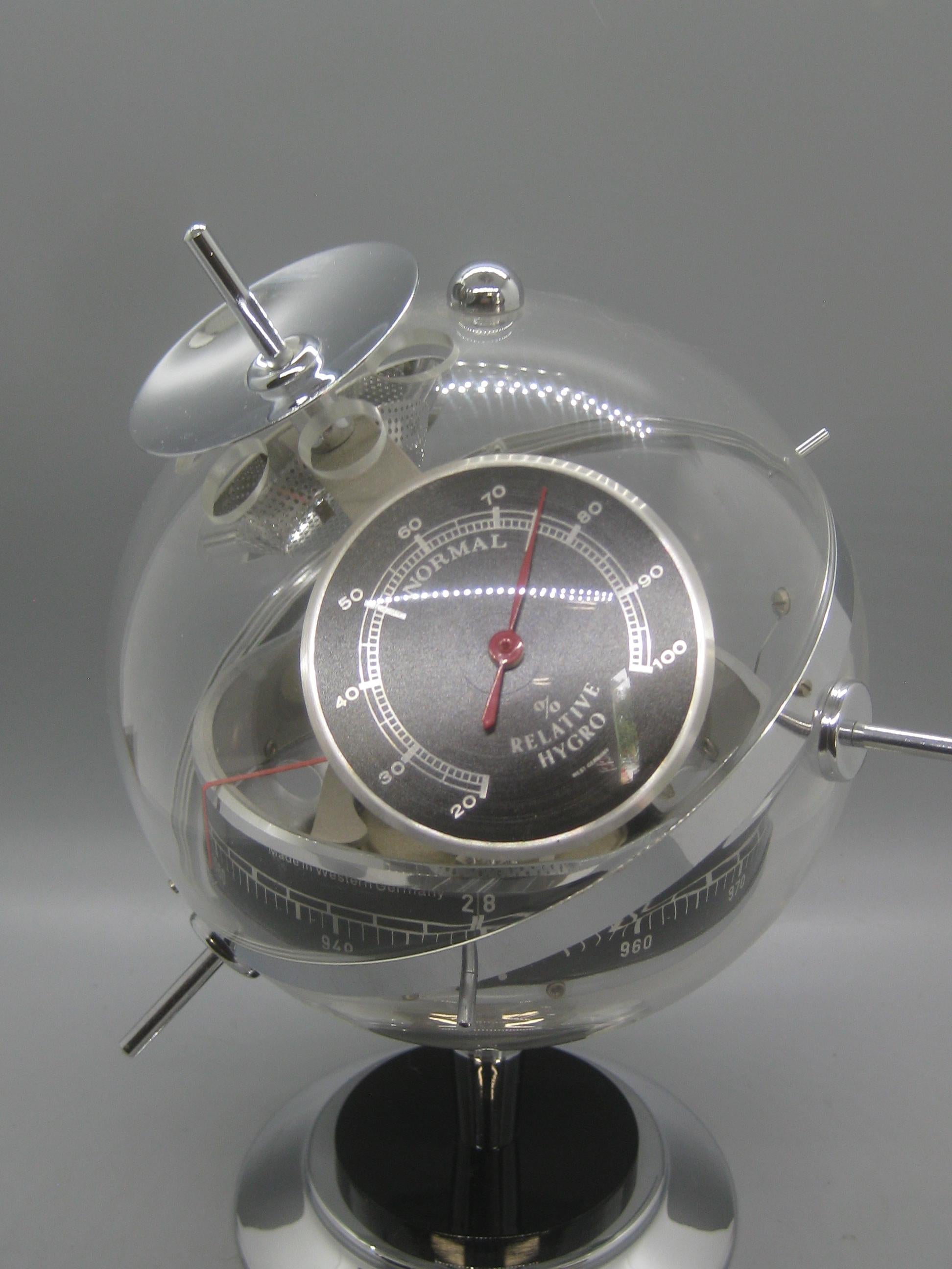 What a cool item! Circa late 1950's. This desktop space age sputnik weather station has a wonderful design and form. Made in West Germany. Has a thermometer , barometer and hygrometer. Chrome finish and in excellent condition for its age. Works