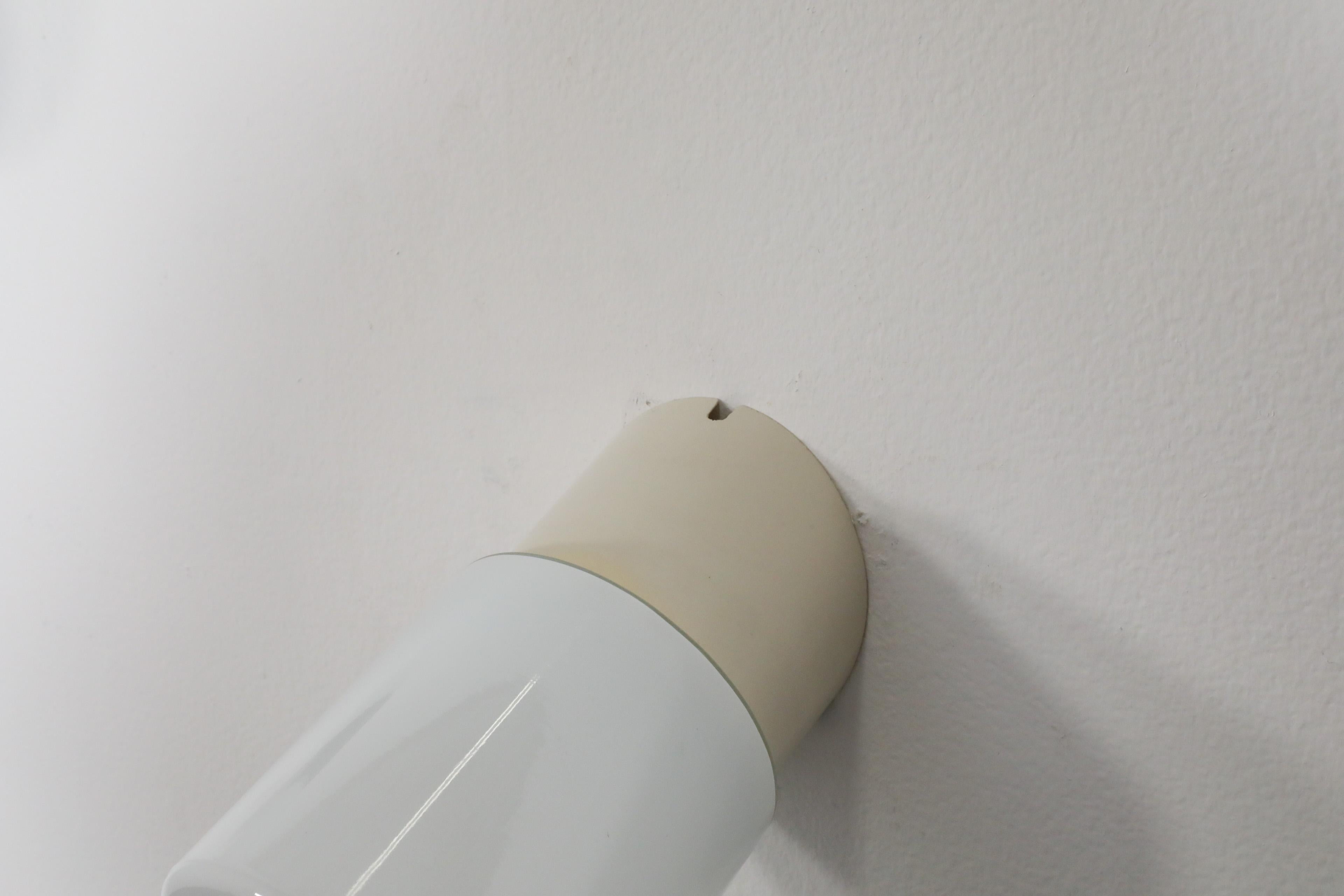 Mid-20th Century 1950's White Cylindrical Wall Sconce with Cream Bakelite Base and Pull Switch For Sale