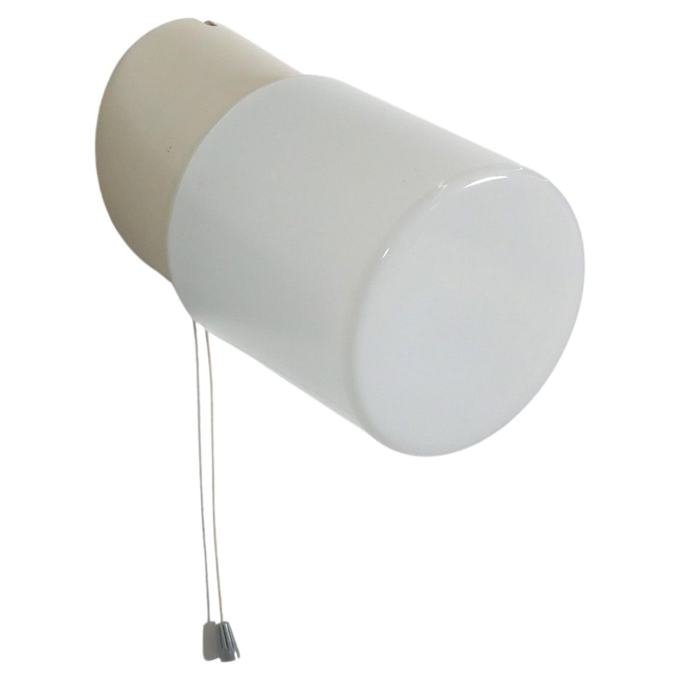1950's White Cylindrical Wall Sconce with Cream Bakelite Base and Pull Switch For Sale