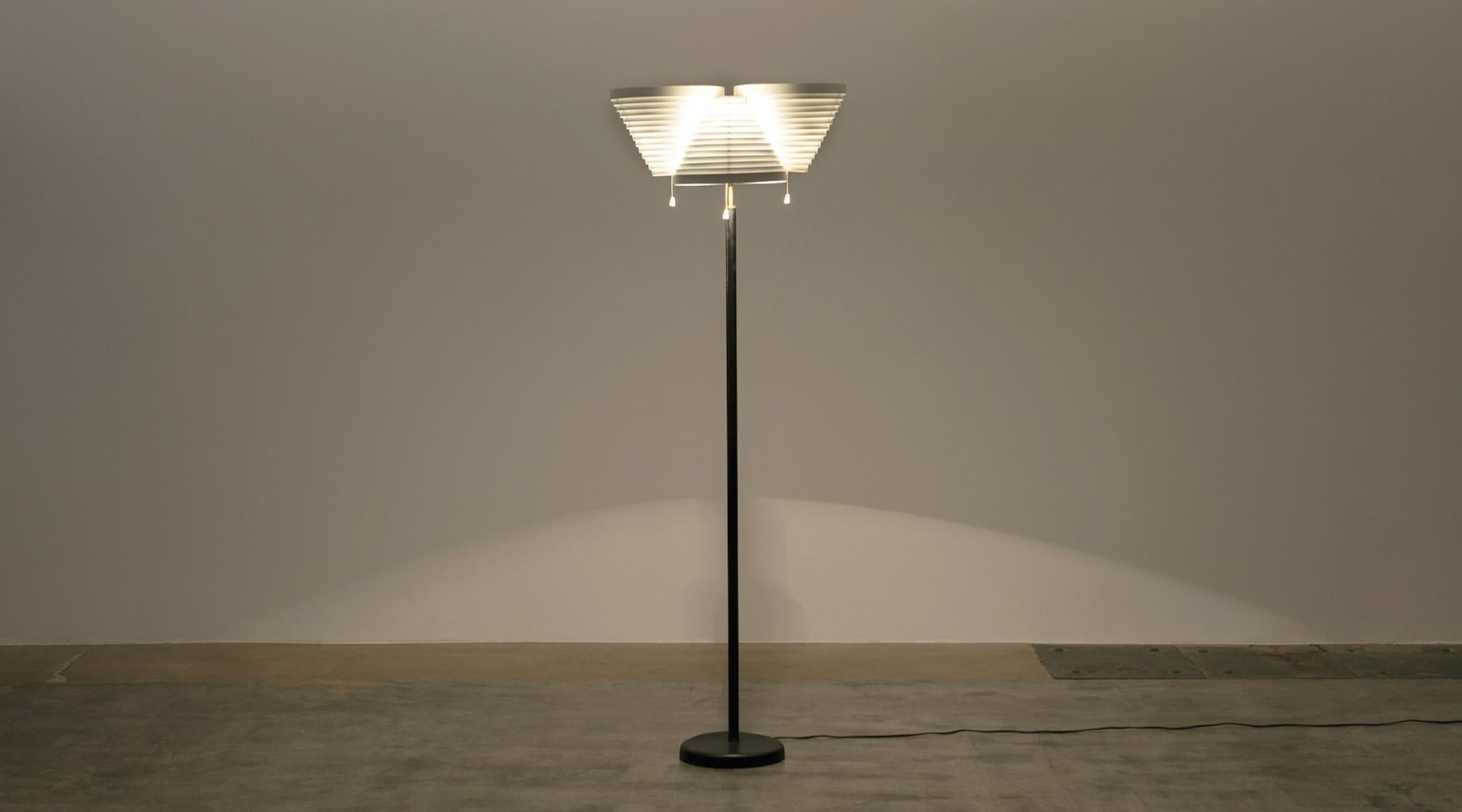 Floor lamp, enameled metal shade, leather covered stem, Alvar Aalto, Finland, 1953

This magnificent floor lamp was designed by the renowned Finnish architect Alvar Aalto. The lamp comes with three thrilling asymmetrical shades in enameled steel.