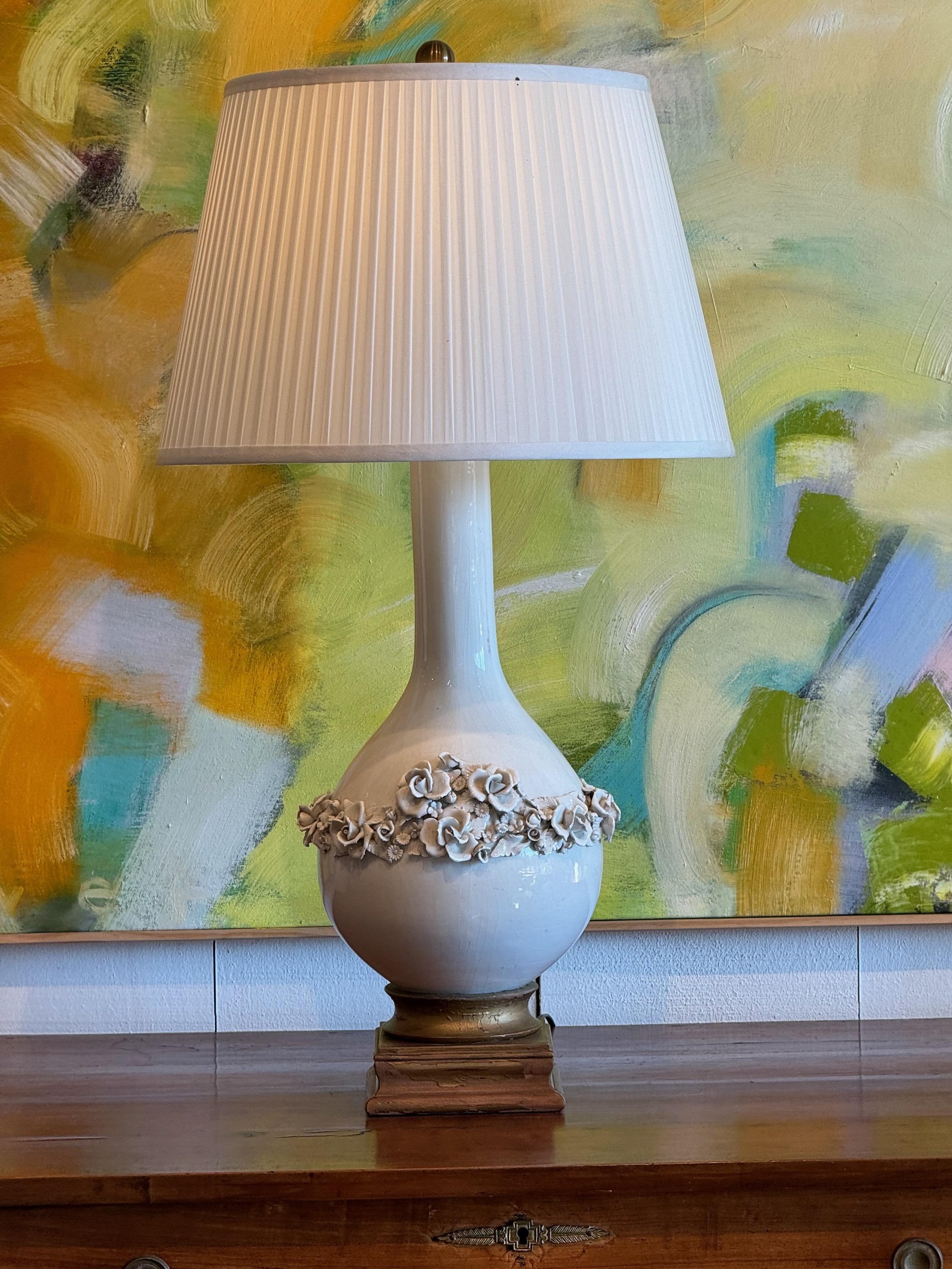 Beautiful blanc de chine lamp with floral appliqués. Made in the 1950s.