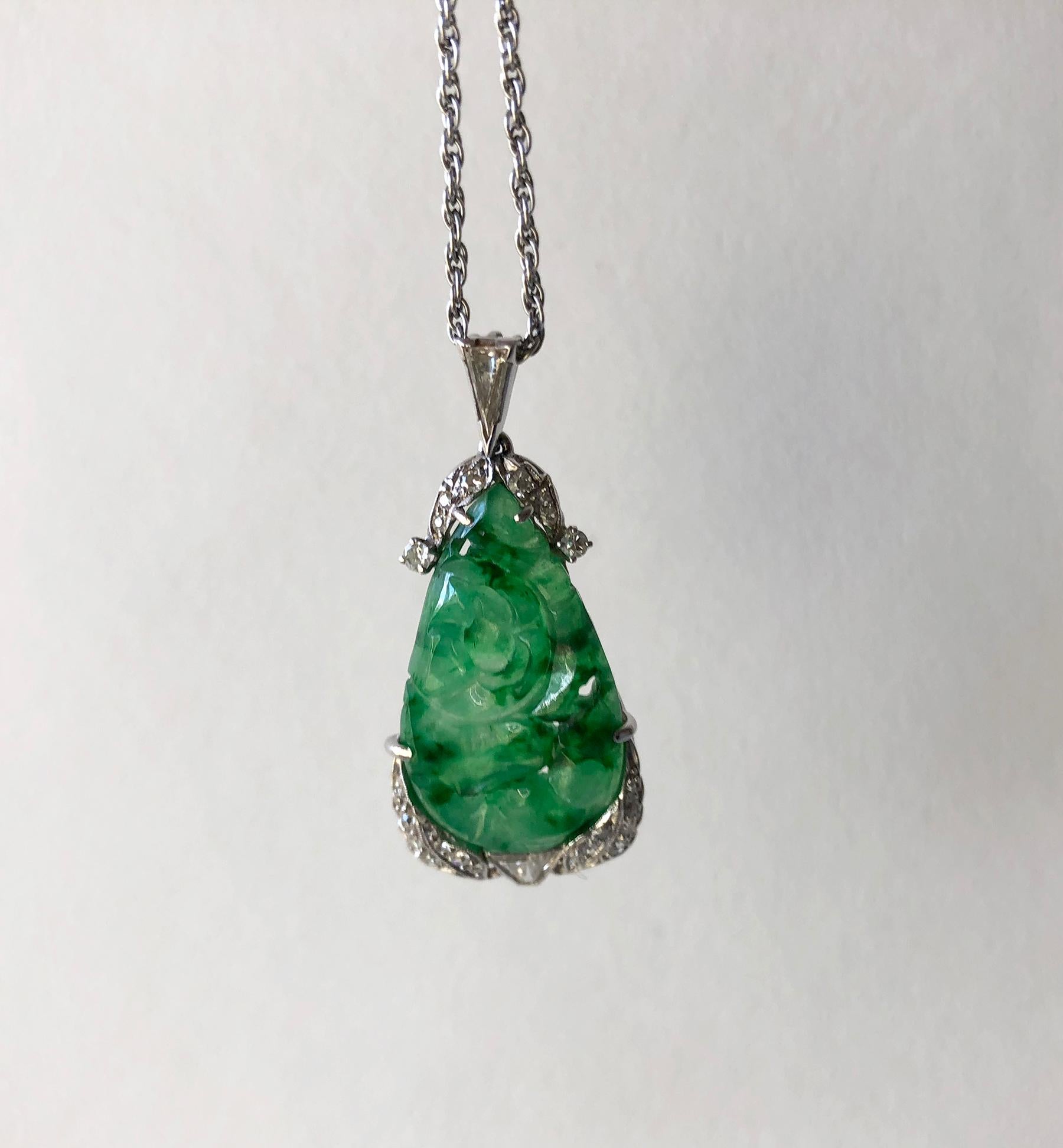 1950's demi parure consisting of carved jade and diamonds set in 14K white gold.  Pendant measures 1.5