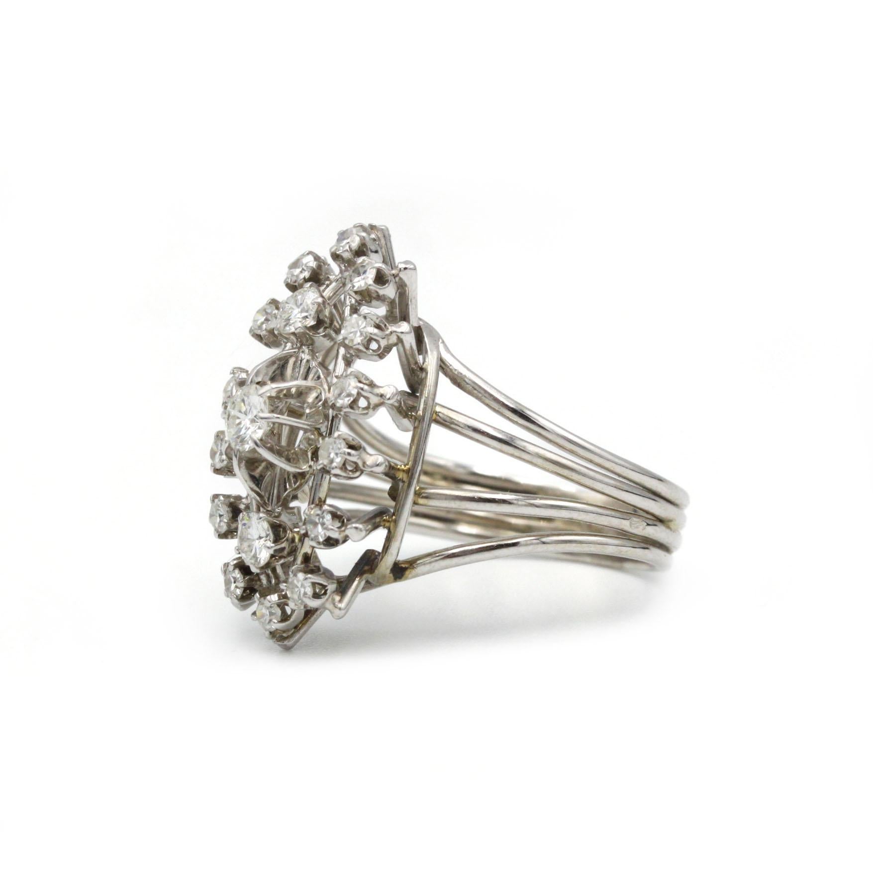 A classic mid-century ring in 18 K white gold, featuring a central cluster of brilliant-cut diamonds radiating in a floral-inspired halo.

Technical Sheet

Attribute	Details
Era / Style	1950s, Retro-Mid-Century
Metal	750‰ White Gold (18 K)
Accent