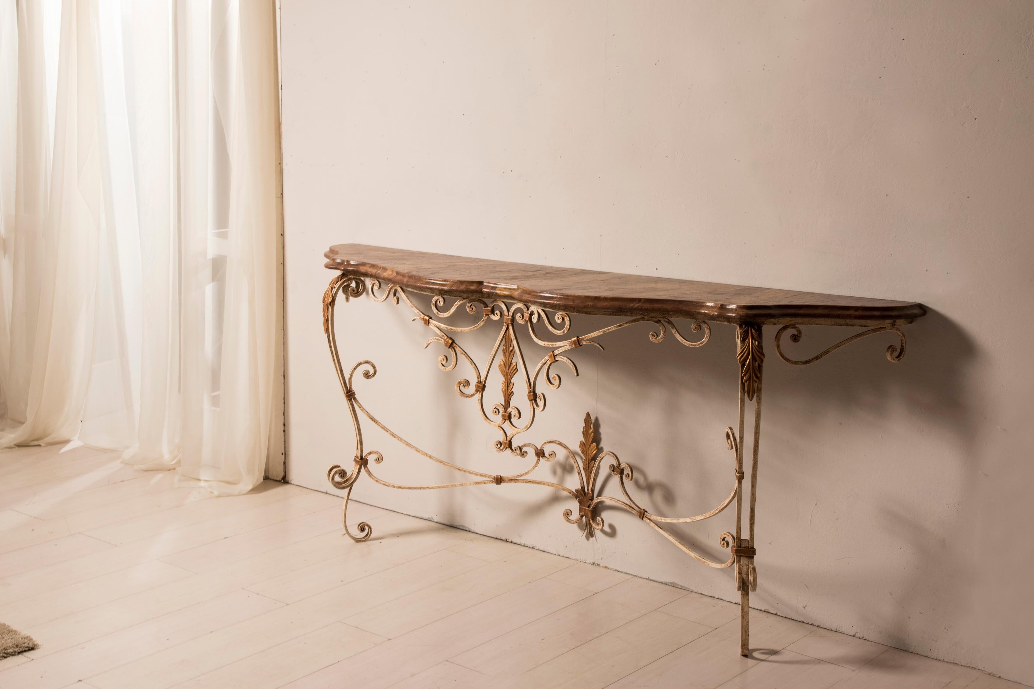 20th Century Lacquered Wrought Iron and Marbled Wood Top Console Table 
This Item comes from Italy from 1950s period.
It has a shabby effect given by passed time on the lacquer. 
The wooden top has been restored in conservative way with wax