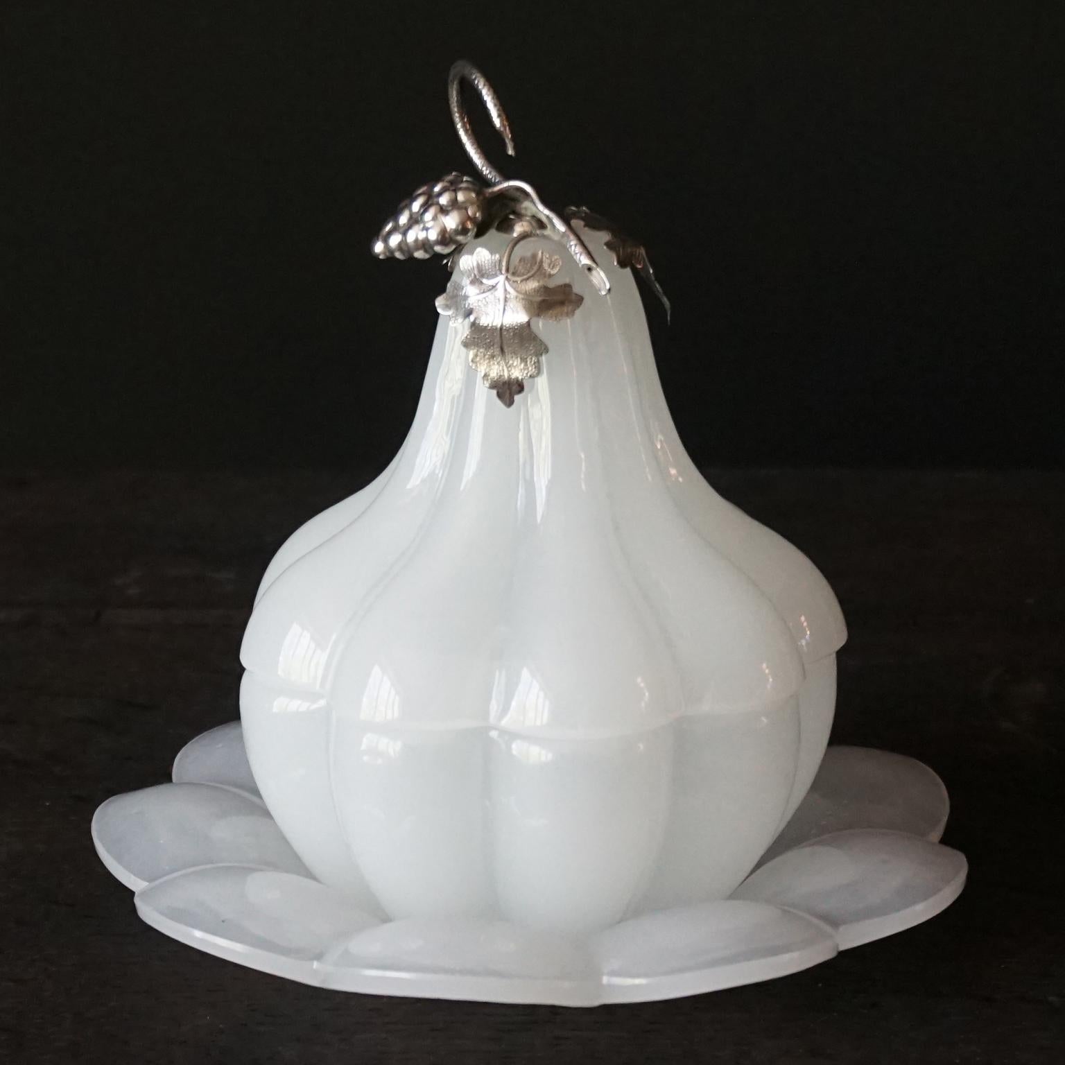 Very cute little 1950s white opaline glass pear or gourd shaped lidded jar in three pieces, a scalloped plate in which the scalloped bottom dish fits perfectly and a scalloped lid.
The lid is adorned with a 2 dimensional little vine with a bunch of