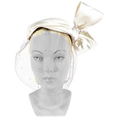 1950s White Satin Cocktail Hat with Sculpted Bow