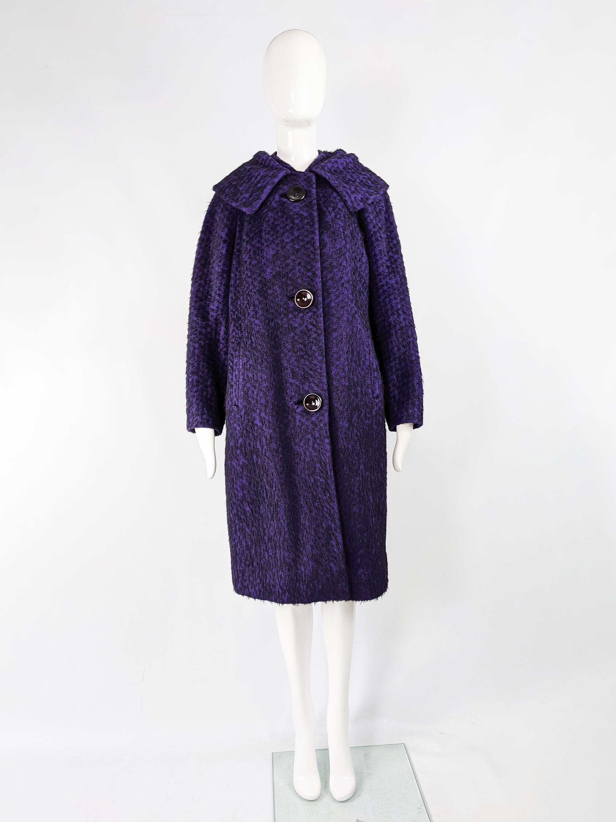 A stunning vintage womens oversized cocoon coat from the late 1950s by Seigal. In a purple and black fuzzy wool fabric with large, dramatic buttons and a huge collar. The oversized, swing style fit creates such a glamorous silhouette and feels so