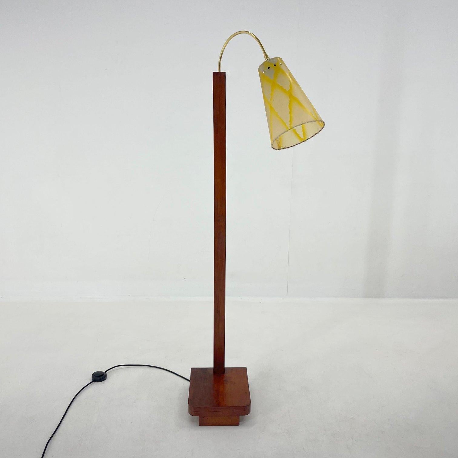 German floor lamp from the 1950's. 
The wooden part was carefully refurbished, new wiring with step-on switch. 
Bulb: 1 x E25-E27.