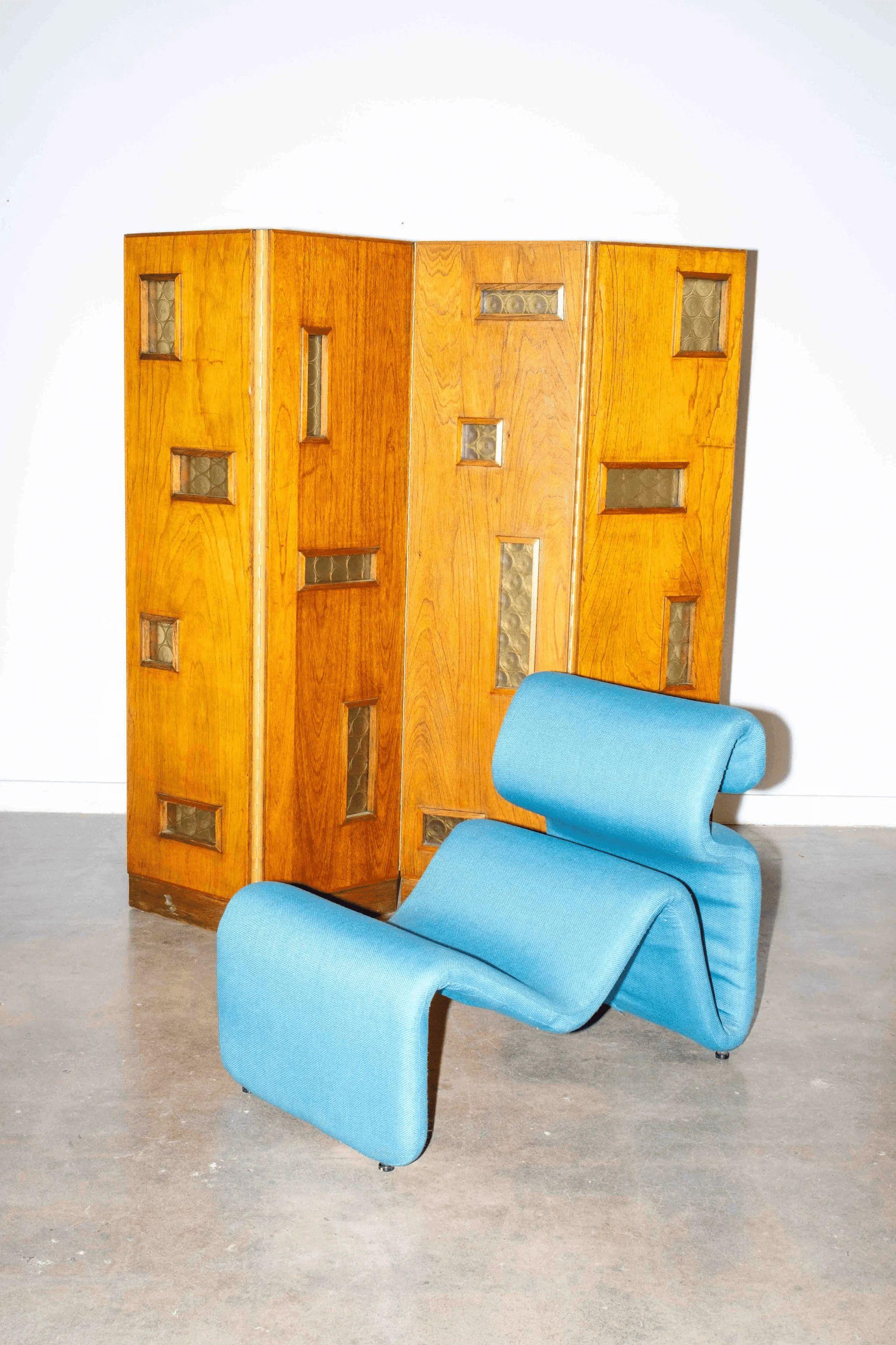 The 1950s four-panel wood screen with amber-hued glass windows is both architectural and whimsical. Featuring rich, patinated wood, brass hinges and a sturdy base - use it to divide a room and add personality to a space.