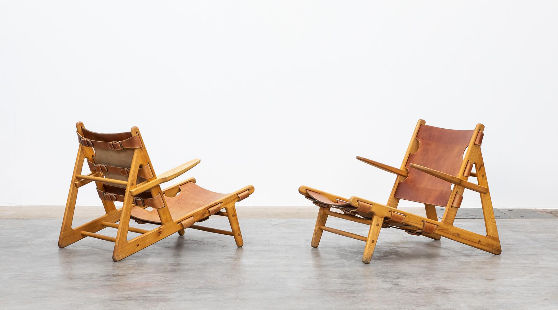 Lounge chairs, 'Hunting Chairs', wood, leather, Borge Mogensen, Denmark, 1950.

This example of the so-called 