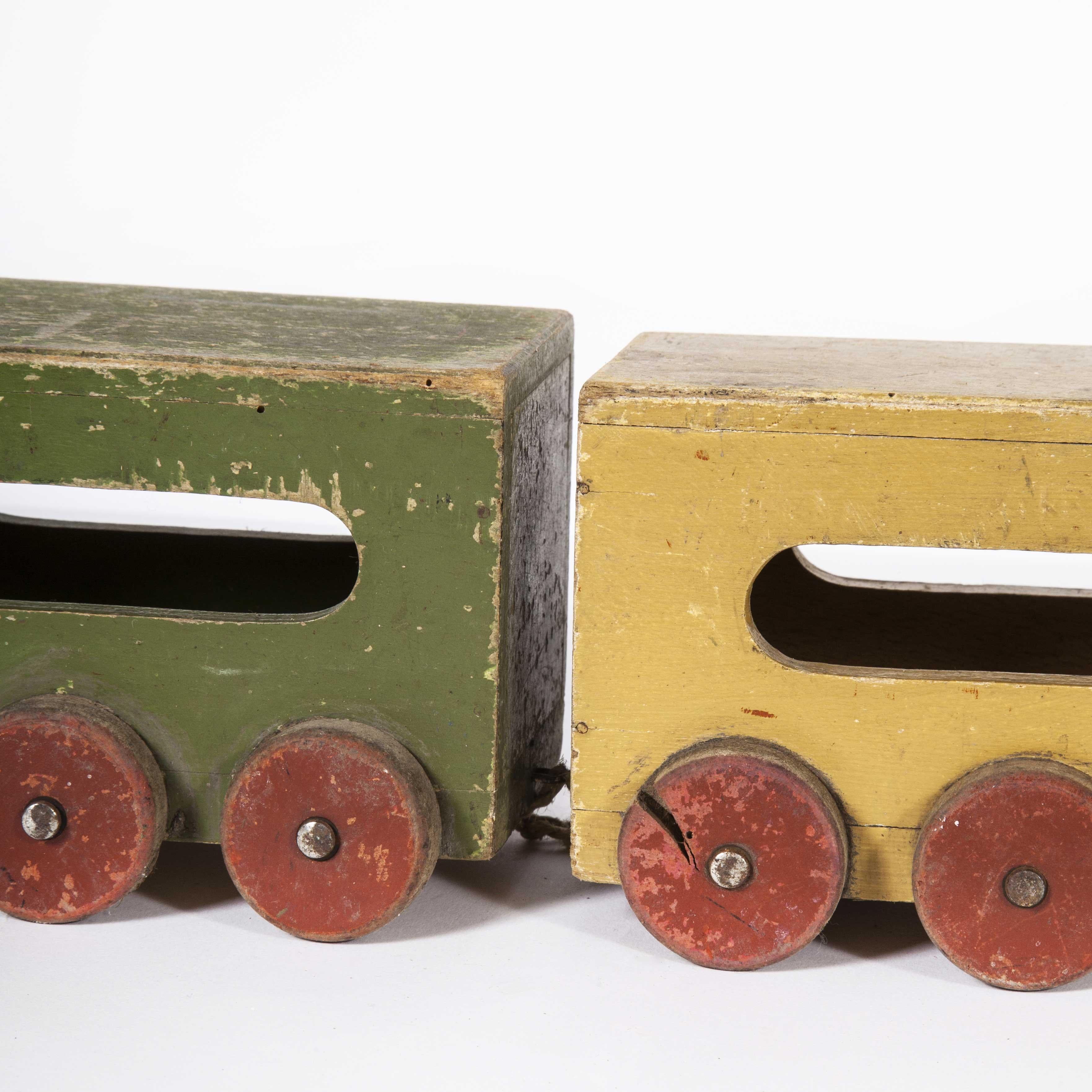 1950s wooden toy train. Beautiful aged and well used wooden toy train. Please note this is a vintage toy and is sold as a decorative item. The toy may not comply with current toy regulations and should not be given to small children.

Workshop