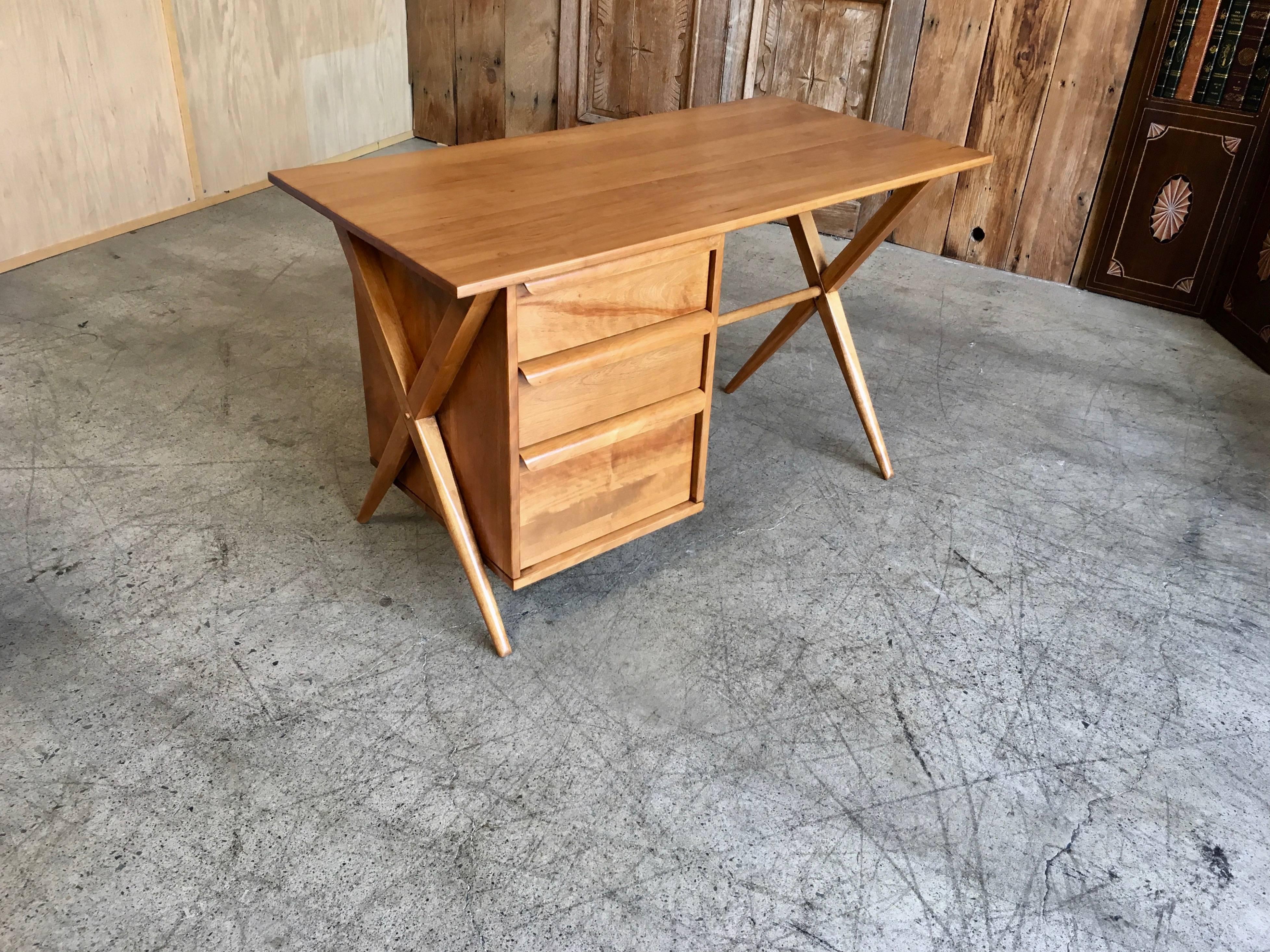 Solid maple crossed leg desk with book cubby on the back side.