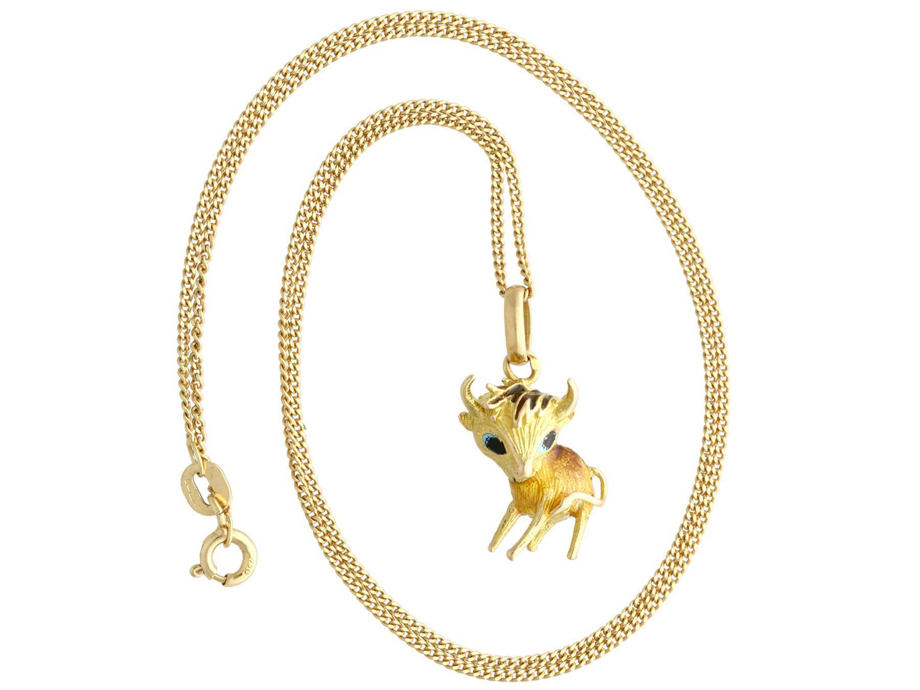 A fine and impressive vintage enamel and 18 karat yellow gold pendant in the form of a horned cow; part of our diverse gemstone jewelry and estate jewelry collections.

This fine and impressive vintage pendant has been crafted in 18k yellow