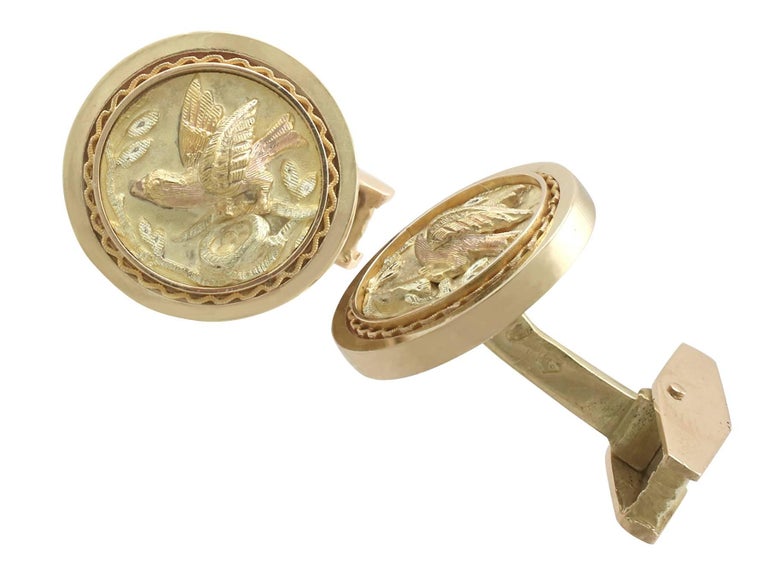 A pair of fine and impressive vintage French 18 karat yellow gold 'bird' cufflinks; part of our diverse mens jewelry collections.

These impressive vintage 1950s bird cufflinks have been crafted in 18k yellow gold.

The anterior face of each link