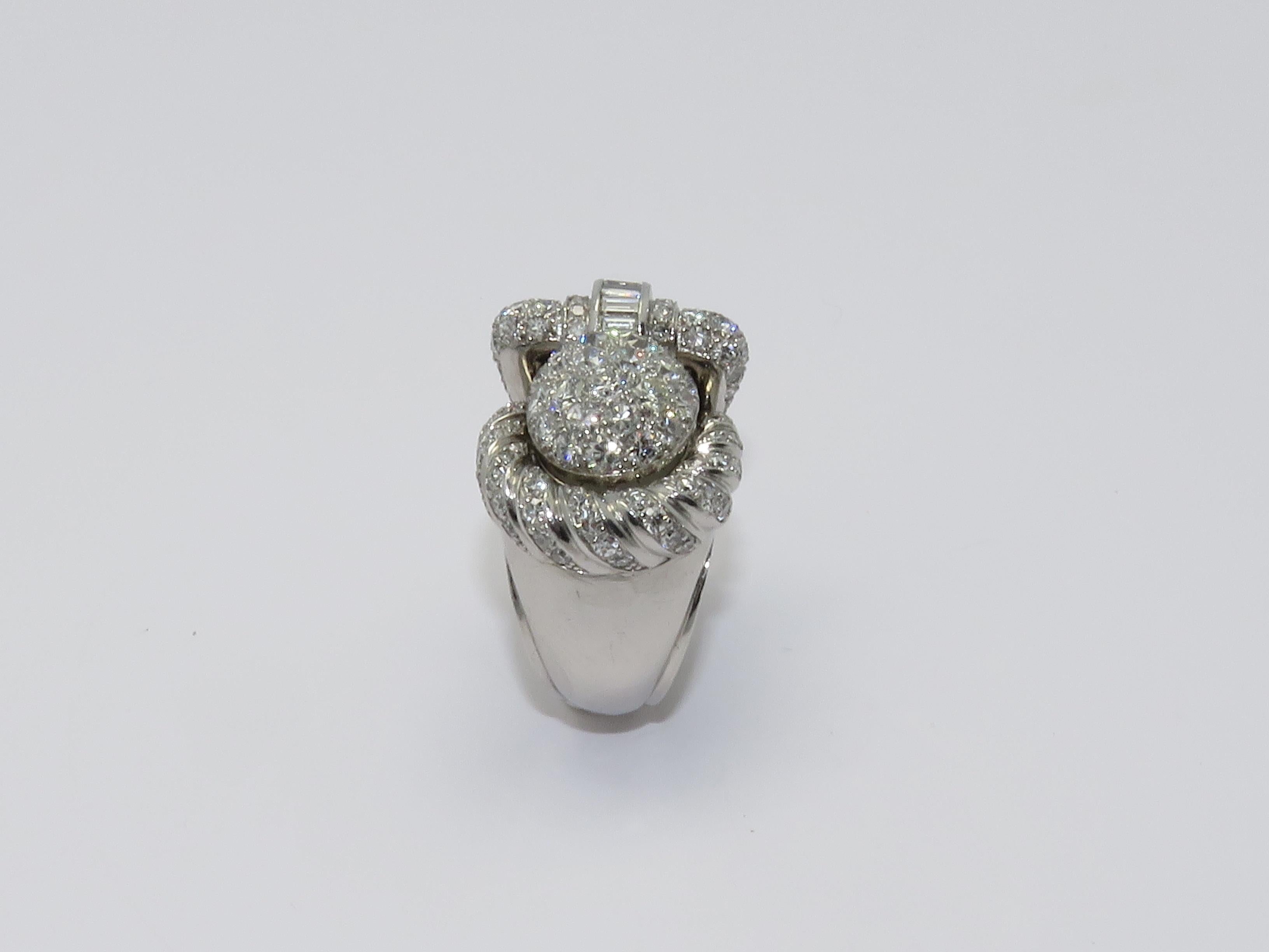 This Watch ring by Zenith is made in platinum and adorned by approximately 3 cts of fine white full cut diamonds.
Working Order
Circa 1950
Ring size: 6
Measurements:
Height: 1.18 in     Length: 1.02 in     Width: 0.75 in     Weight: 33.50 grams