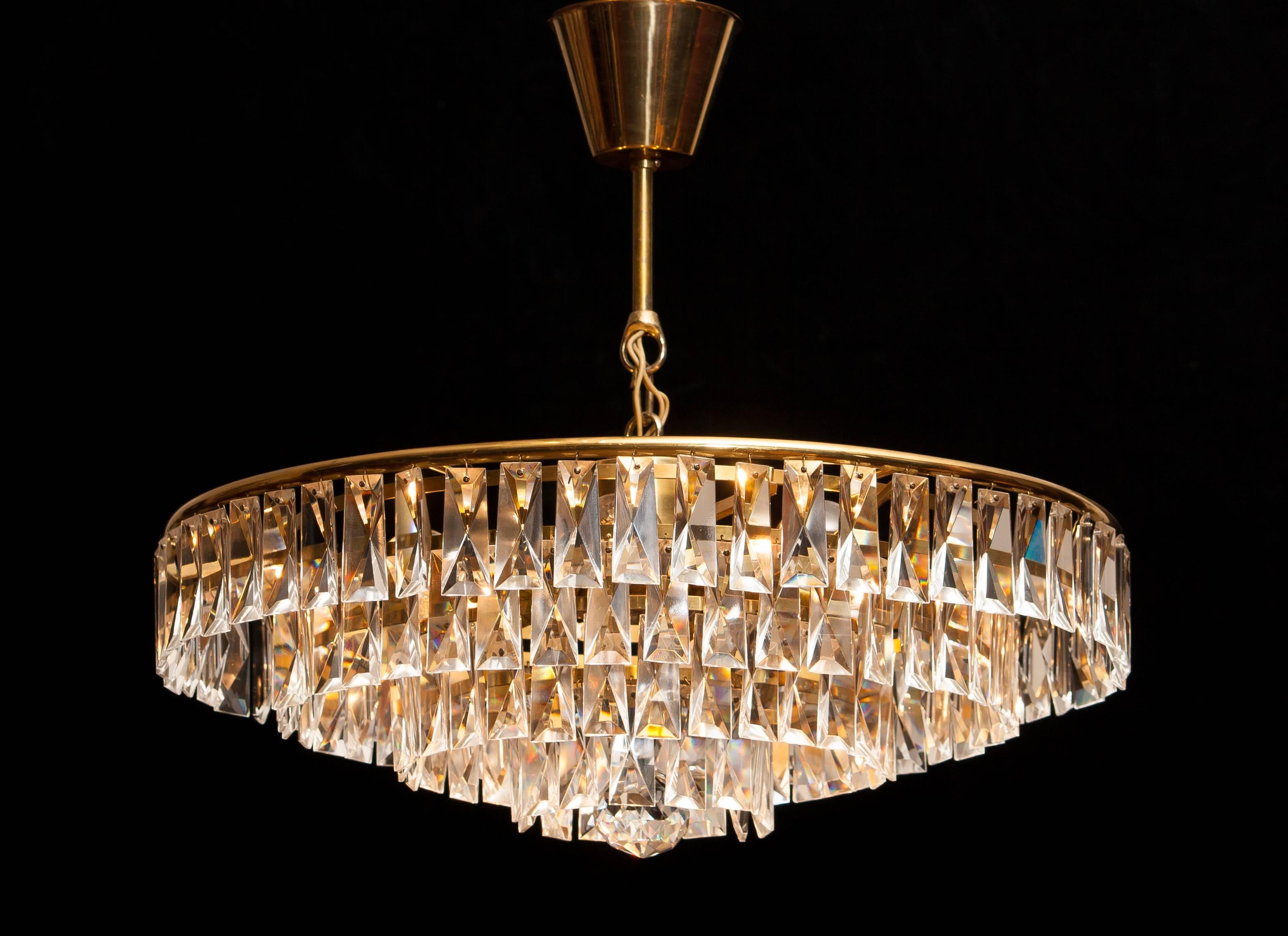 Amazing chandelier, ceiling lamp.
This lamp is made of a brass frame with beautiful crystal elements which gives a stunning light shining.
It is in a wonderful condition.
Period 1950s.
Dimensions: H 30 cm, ø 50 cm.