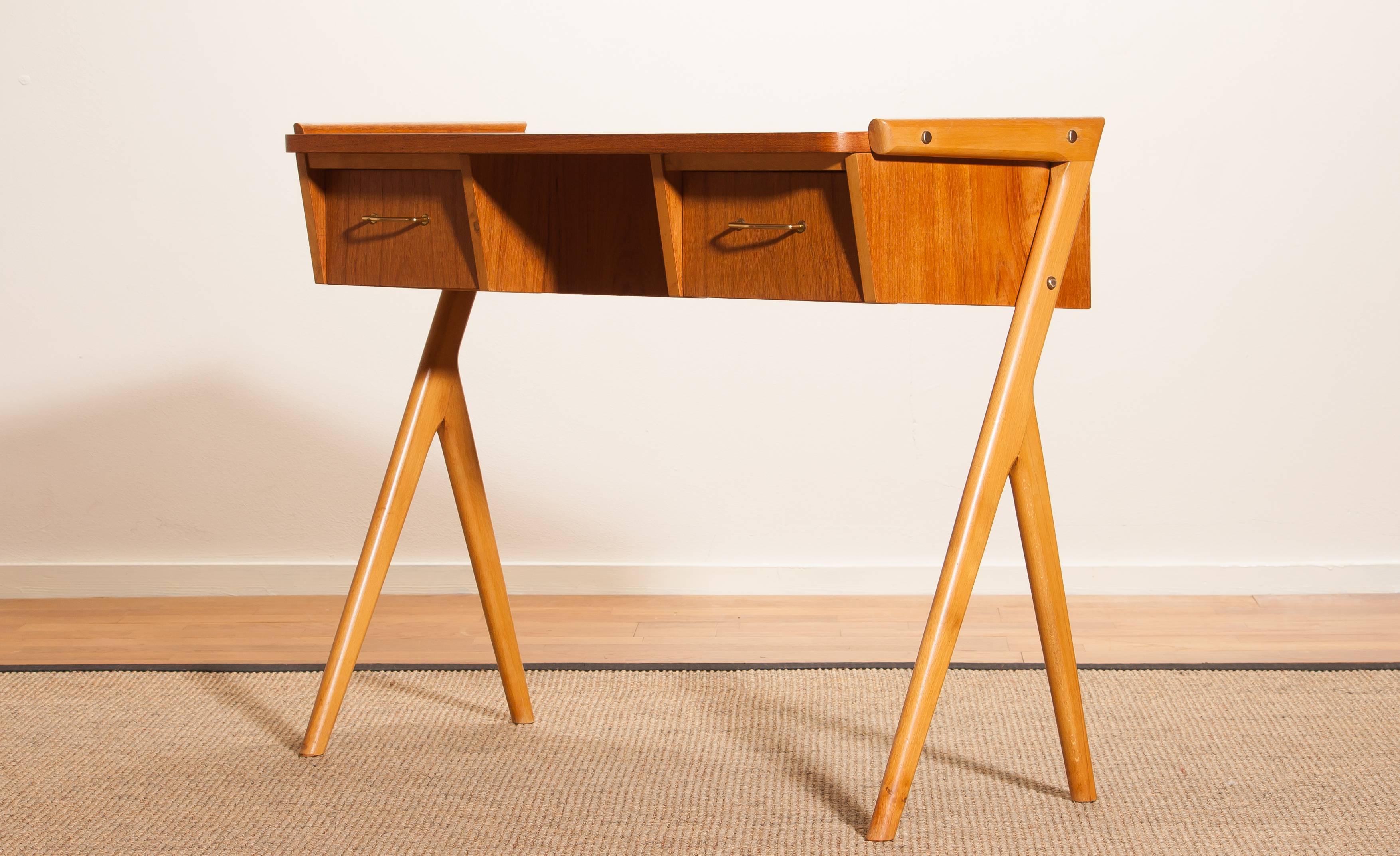 Very beautiful ladies desk from Sweden
The table is made of teak and has two drawers with brass details.
It is in a very nice condition.
Period 1950s
Dimensions H. 70 cm, W. 84cm, D. 40 cm.
