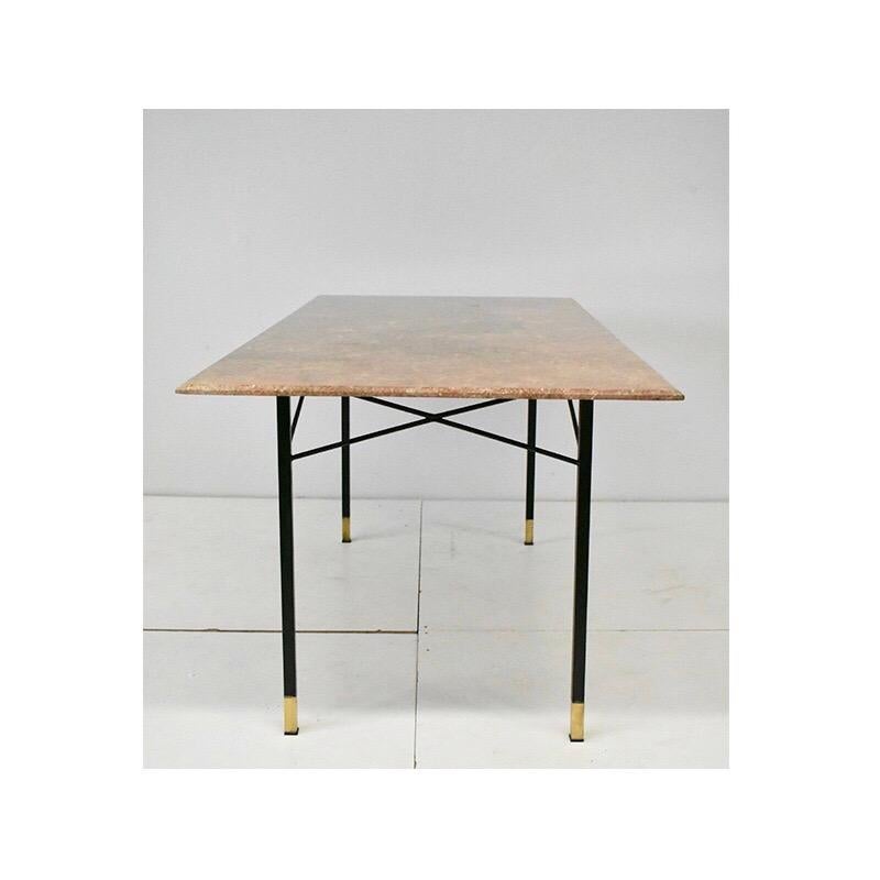 1950s vintage dining table, Italian manufacture.

The table has a black iron structure with brass feet with a rectangular top in marble.