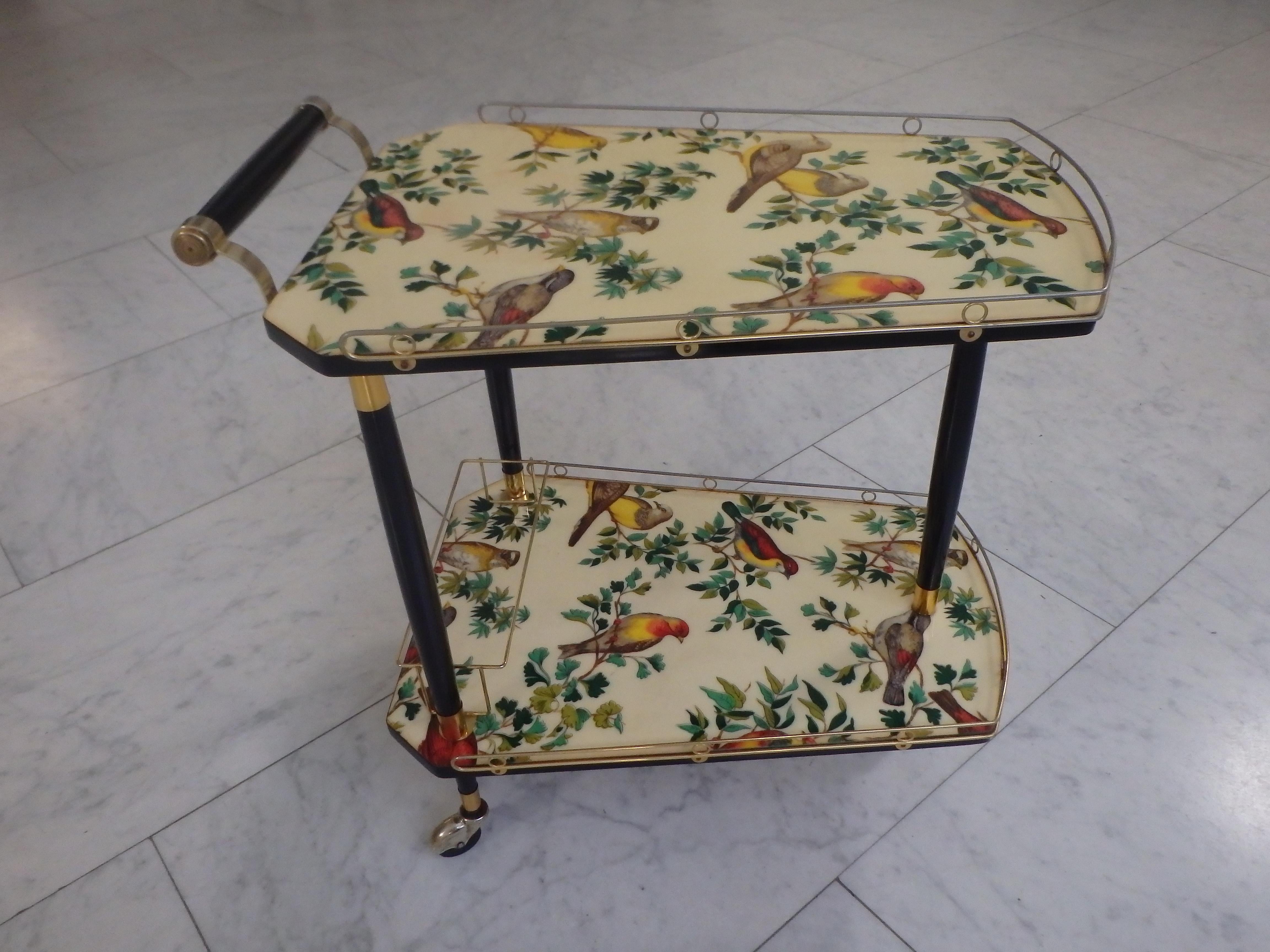 Mid-Century Modern 1950thies bar cart on 3 wheels with beautiful birds on the shelf's  For Sale