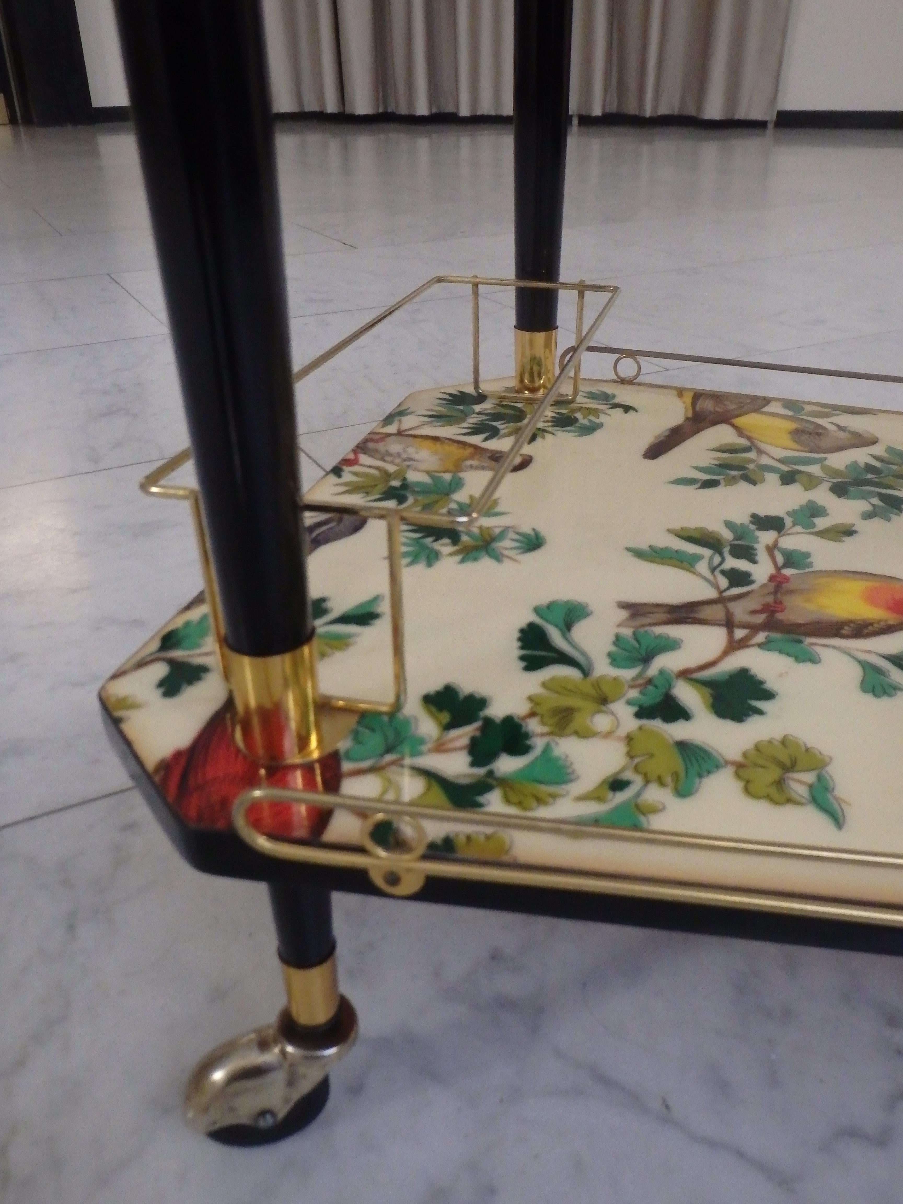 Brass 1950thies bar cart on 3 wheels with beautiful birds on the shelf's  For Sale