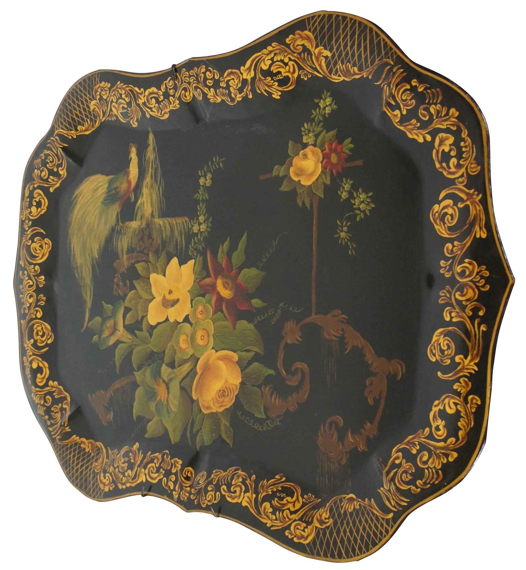 Vintage 1951 midcentury scalloped Americana Folk Art toleware tray featuring a gold leaf border, an array of flowers, and a bird (Peacock) with long tail feathers perched on a fountain. Signed on backside, Betty Johnson. Attributed to Wingcraft.
  