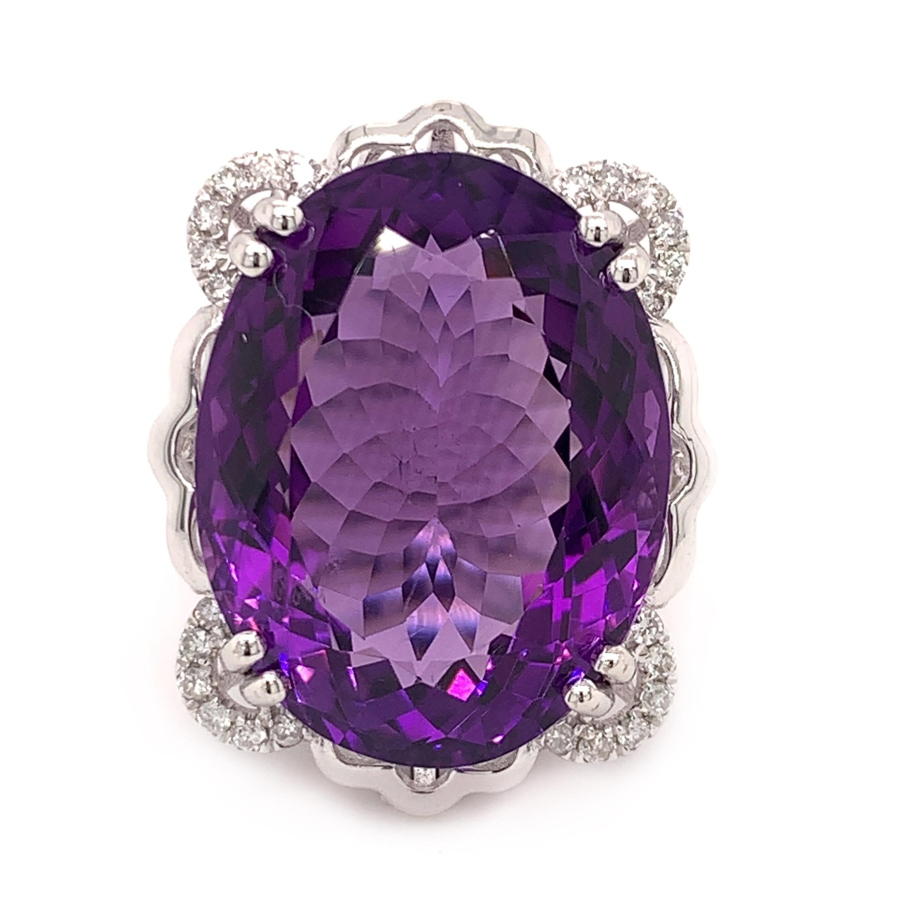 Glamorous amethyst diamond cocktail ring. High brilliance, transparent clean, rich eggplant purple tone, natural 19.51 carats oval faceted amethyst mounted in an open basket with eight bead prongs, accented with round brilliant cut diamonds.