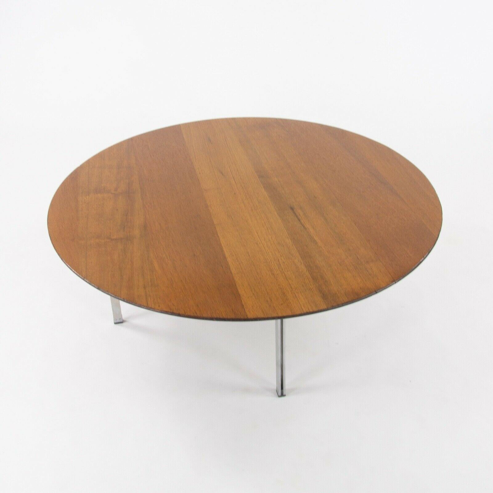 Listed for sale is a very rare Parallel Bar Series coffee table produced by Knoll Associates and designed by Florence Knoll. This table was specified with a solid walnut top (a very unusual detail) and parallel bar metal legs. This is a terrific