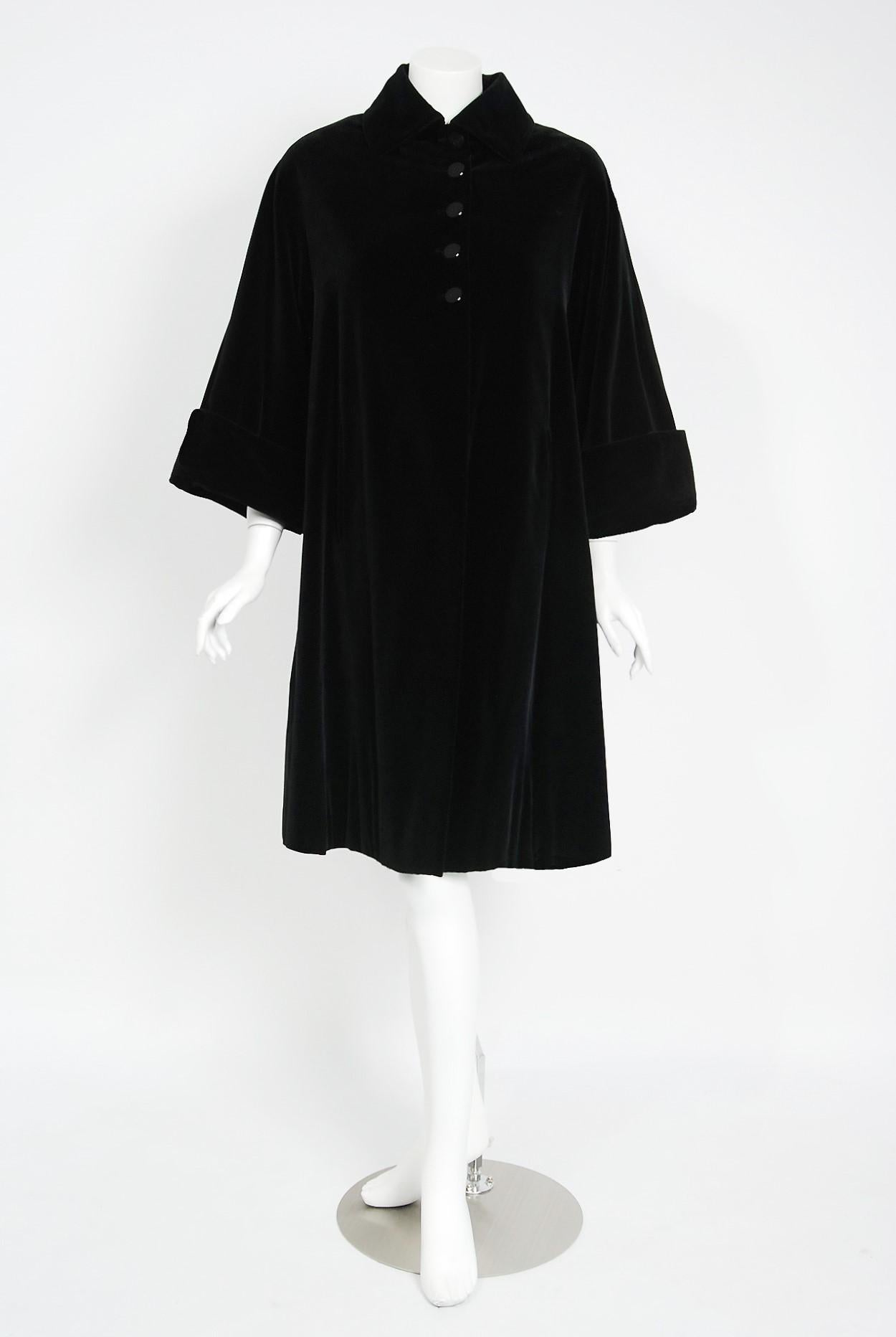 Breathtaking Pierre Balmain Paris black velvet swing coat dating back to his documented 1951 Fall/Winter collection. Pierre Balmain worked under Robert Pigiuet, Molyneux, and Lucian Lelong, where he worked closely with Christian Dior. In 1945 is