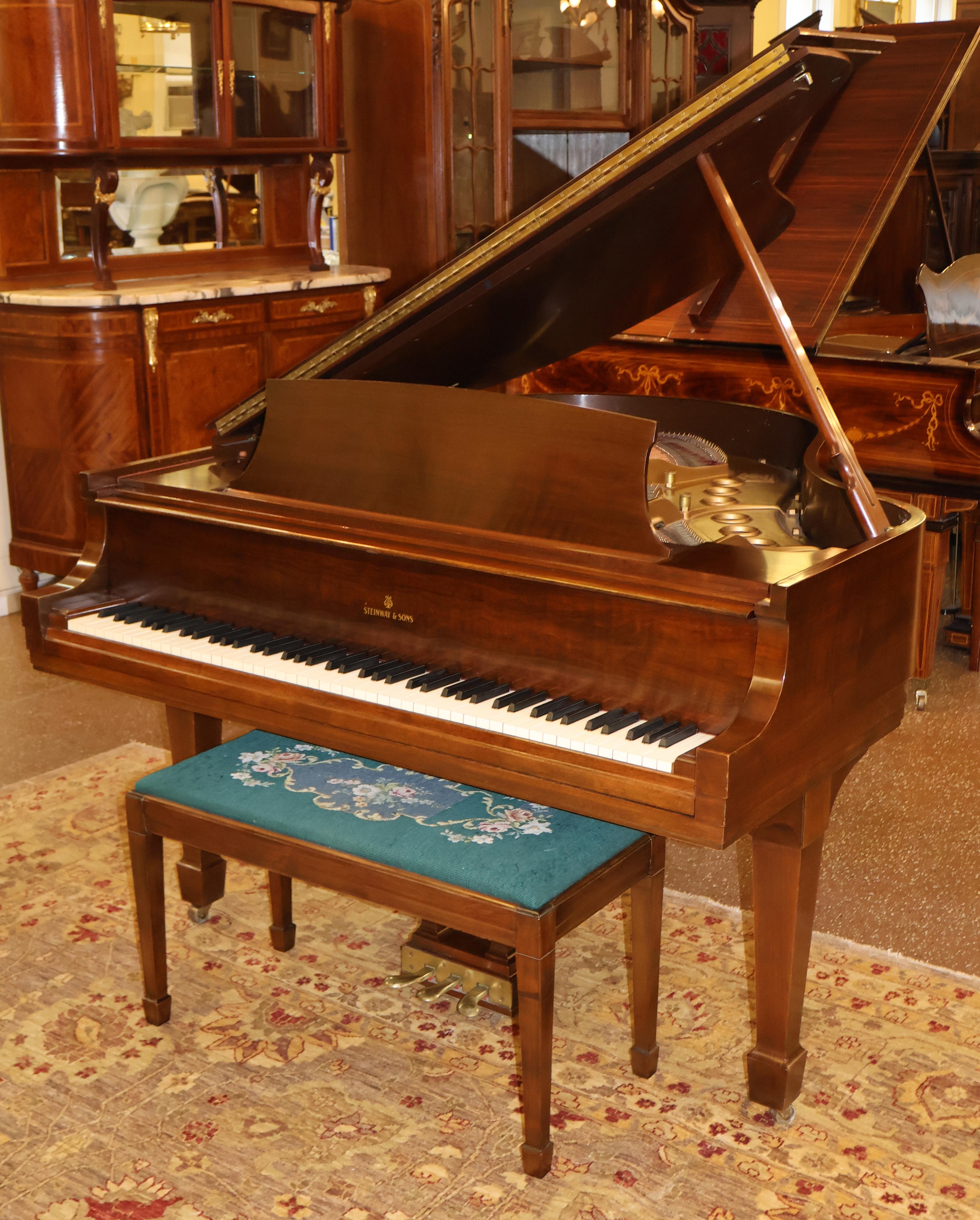 This Steinway was made in 1951 and is in very clean! The soundboard is in excellent shape and the piano has a nice sound to it! The case is also in very good vintage condition! The keys are ivory and the bench has needle point fabric.
