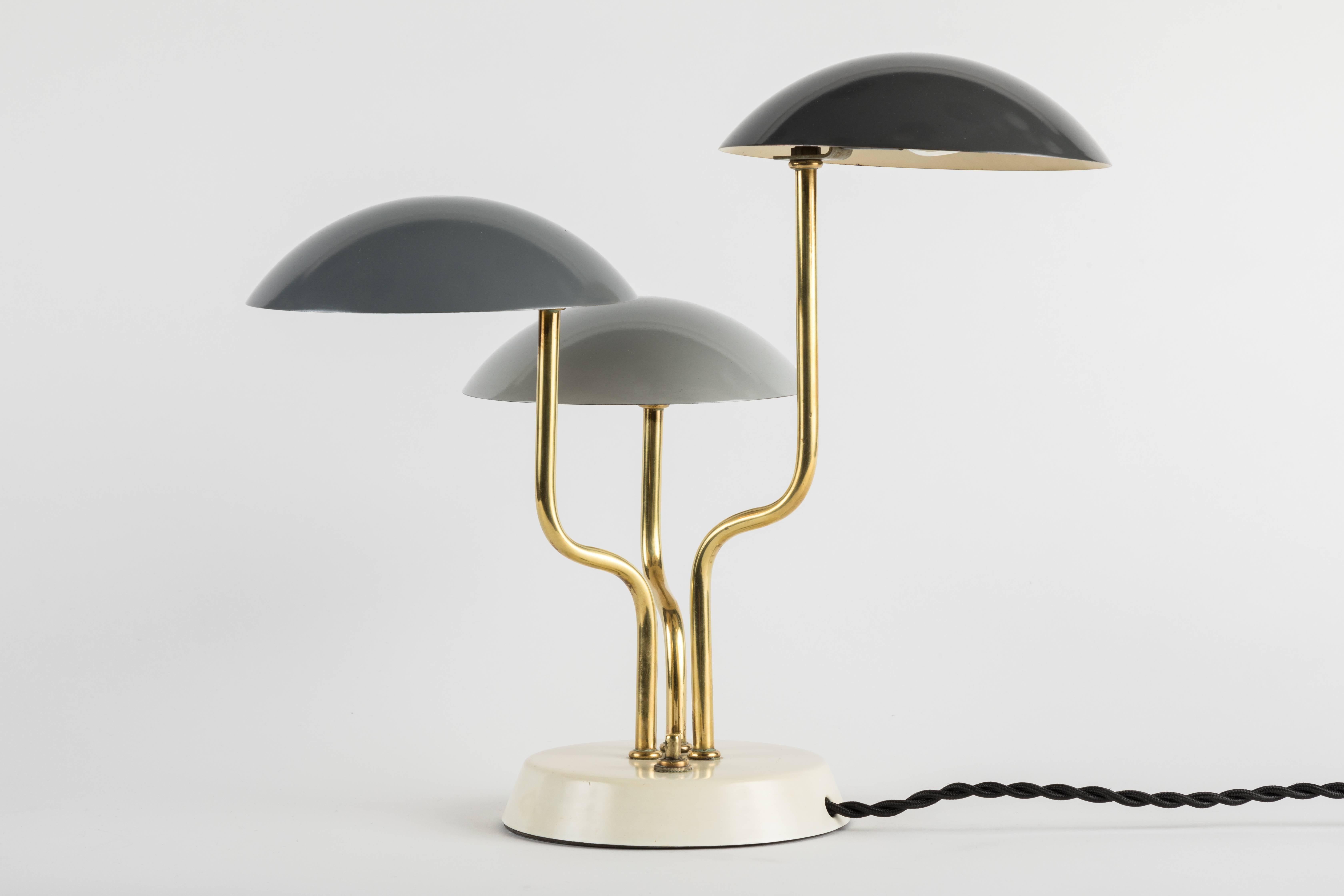 1950s Gino Sarfatti Table lamp for Arteluce. A striking yet minimalistic table lamp designed by Gino Sarfatti, circa 1952. This extremely rare and iconic design is executed in lightly patinated brass and painted metal with original color in very