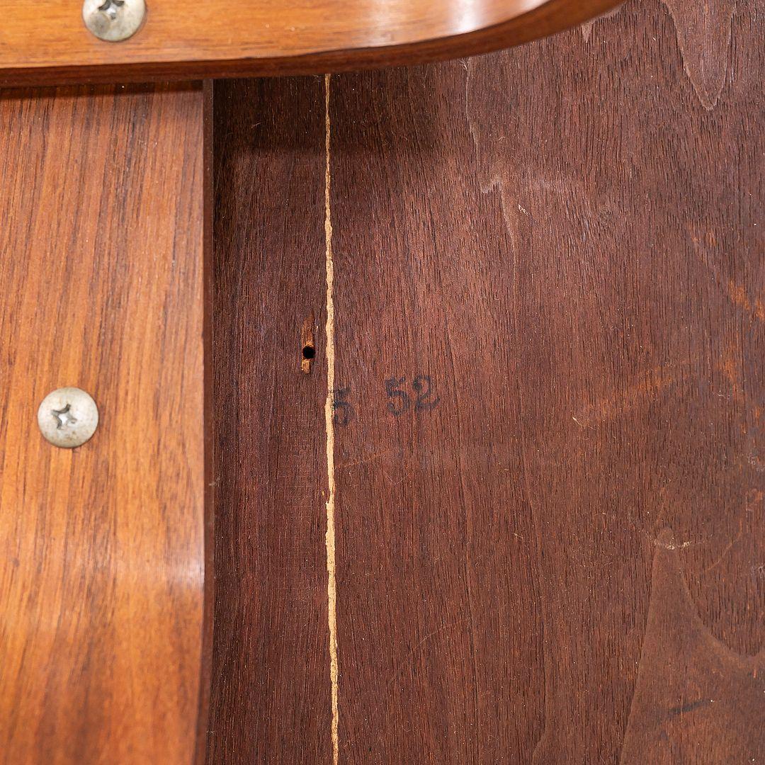 This is a mega rare upholstered Eames DCW dining chair, dating to March of 1952. It has the 5-2-4 screw pattern underneath, indicating early Herman Miller production. Its also stamped 