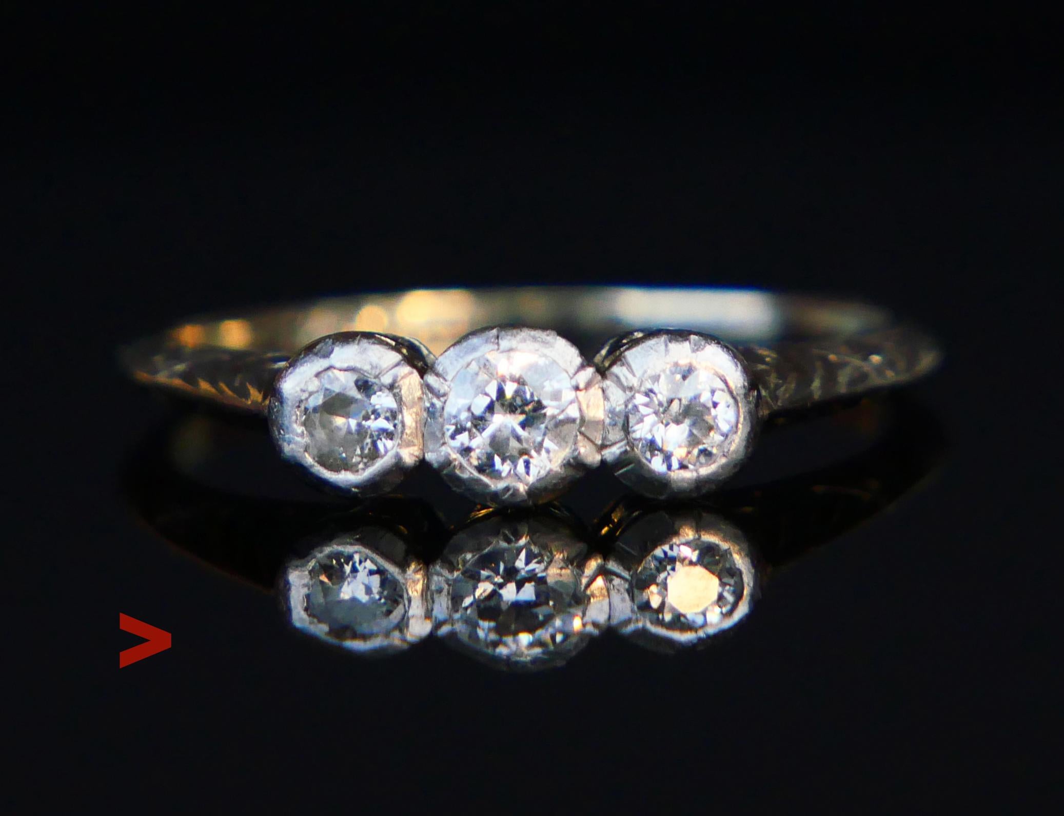 Vintage Three Stones ring in solid 18K White gold with three bezel set natural Diamonds of old European Diamond cut.

Crown measures 12 mm x 5mm x  4 mm deep. Largest Diamond is Ø 4 mm x 2.5 mm deep / ca. 0.3 ct and two stones on the flanks ca. Ø