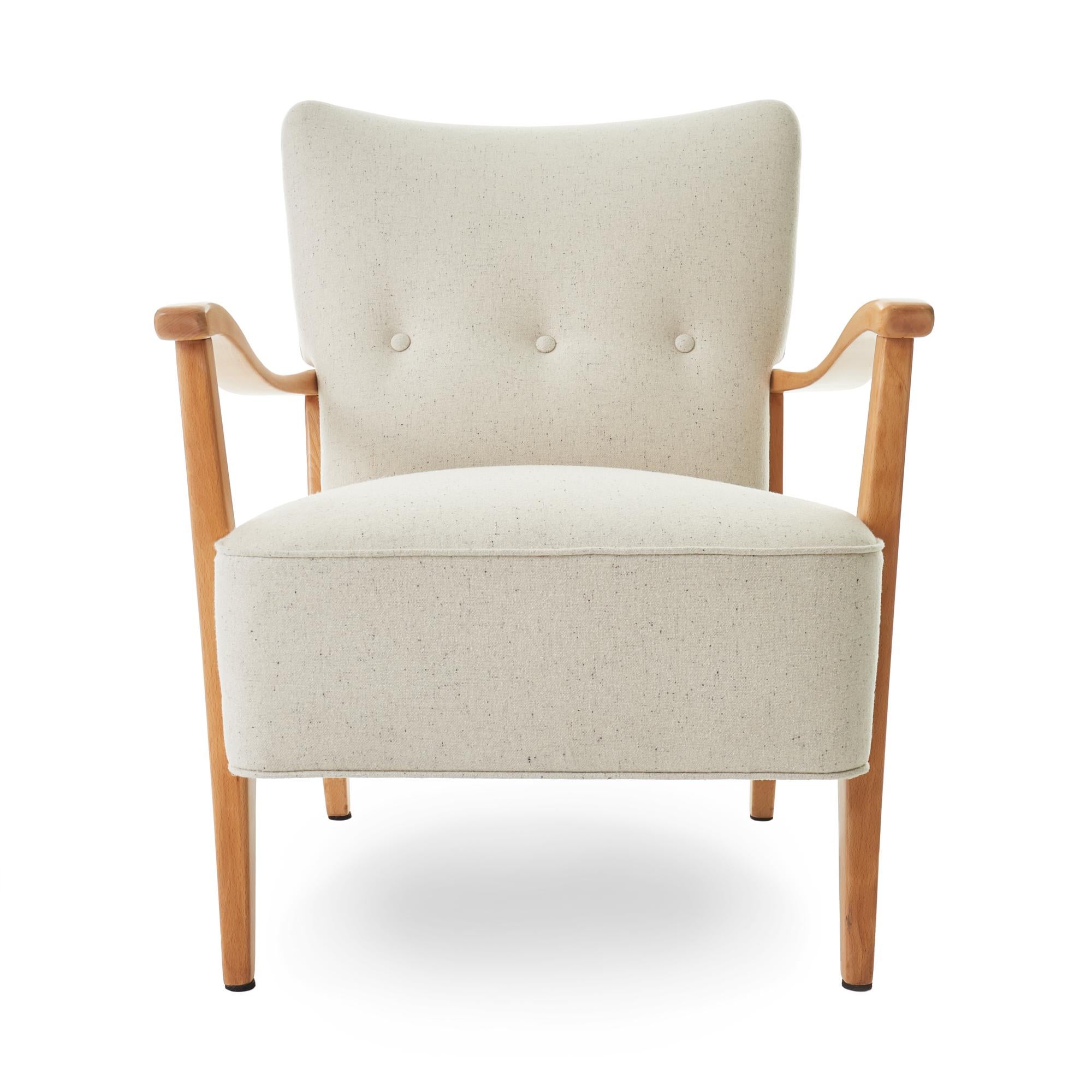 Lovely c1953 Folke Ohlsson for AP Madsen' ‘Modern’ armchair. Originally manufactured in Vancouver, Canada. Newly refinished beech wood frame, and reupholstered in Pollack’s Lana E Seta wool in ‘Cocoon’. This chair is in perfect condition and ready