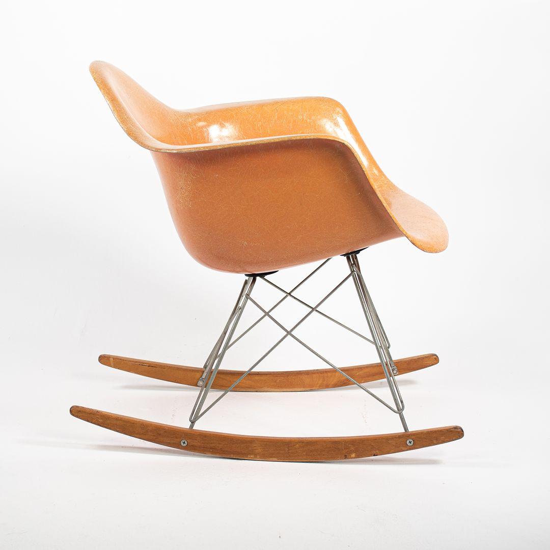 This is a ‚ÄòRAR‚Äô Rocking Chair, designed by Charles & Ray Eames in 1950. This particular chair dates to around 1953. The piece consists of a fiberglass ‚Äúshell‚Äù seat and back, and has steel legs & wooden runners. The parts are all original. 
