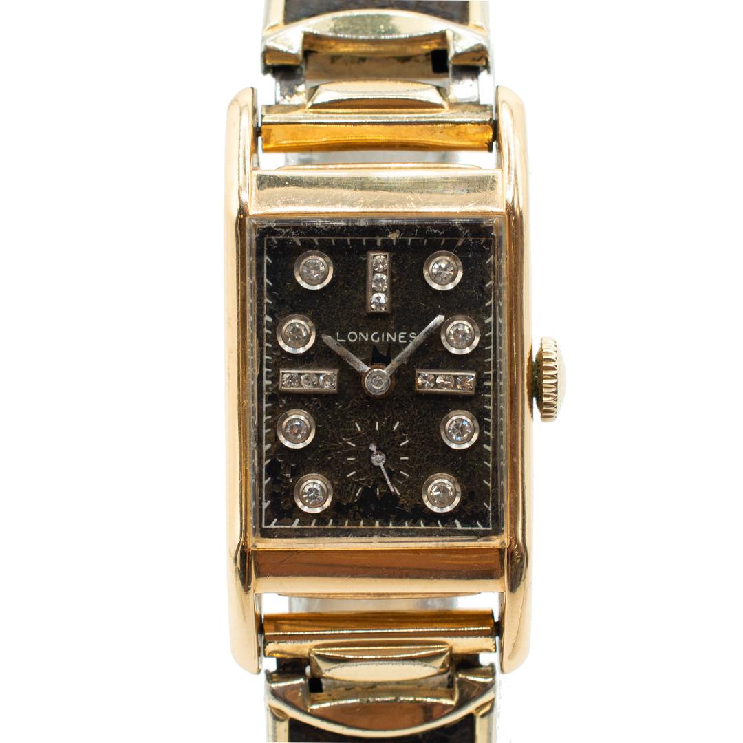 
    Brand: Longines
    Model: Wittnauer 
    Reference: 7596576
    Gender: Ladies
    Year of Production: 1953
    Movement: Automatic
    Case Material: 14K Yellow Gold
    Case diameter (mm): 19mm
    Dial Color: Black
    Weight (gr): 46.80