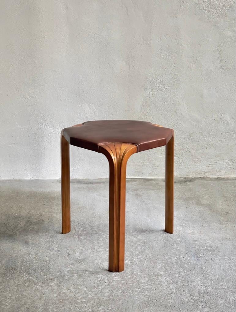 Finnish 1954 Alvar Aalto stool model X602 in rich patinated birch and Niger leather For Sale