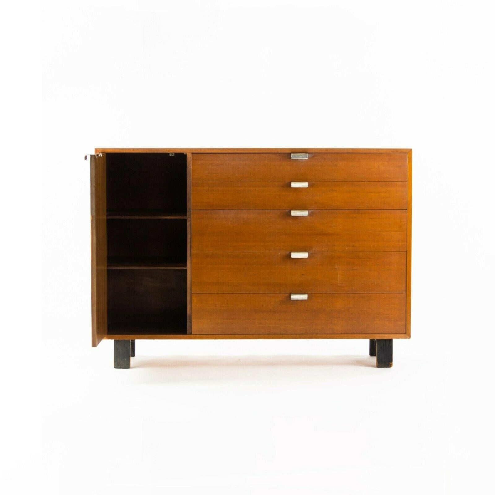 Listed for sale is a circa 1954 George Nelson for Herman Miller Model 4936 5-Drawer Basic Cabinet Series dresser / credenza. This is a delightfully original piece. The condition overall is very good to excellent for a vintage example with some wear