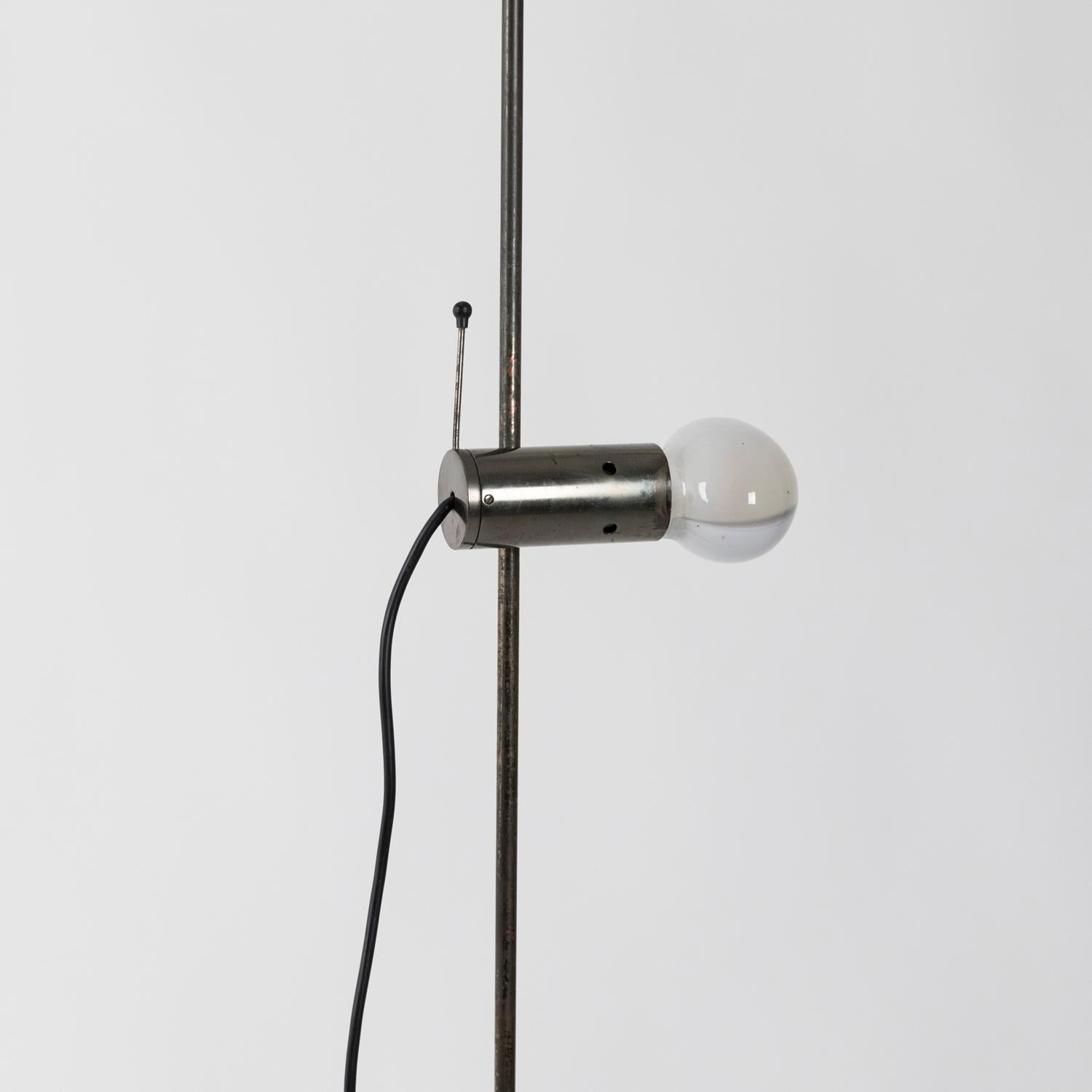 Mod.387 floor lamp designed in 1954 by Tito Agnoli for O-Luce in a rare bronzed version, travertine base. Light spot is pivoting and moves up and down along the stem.